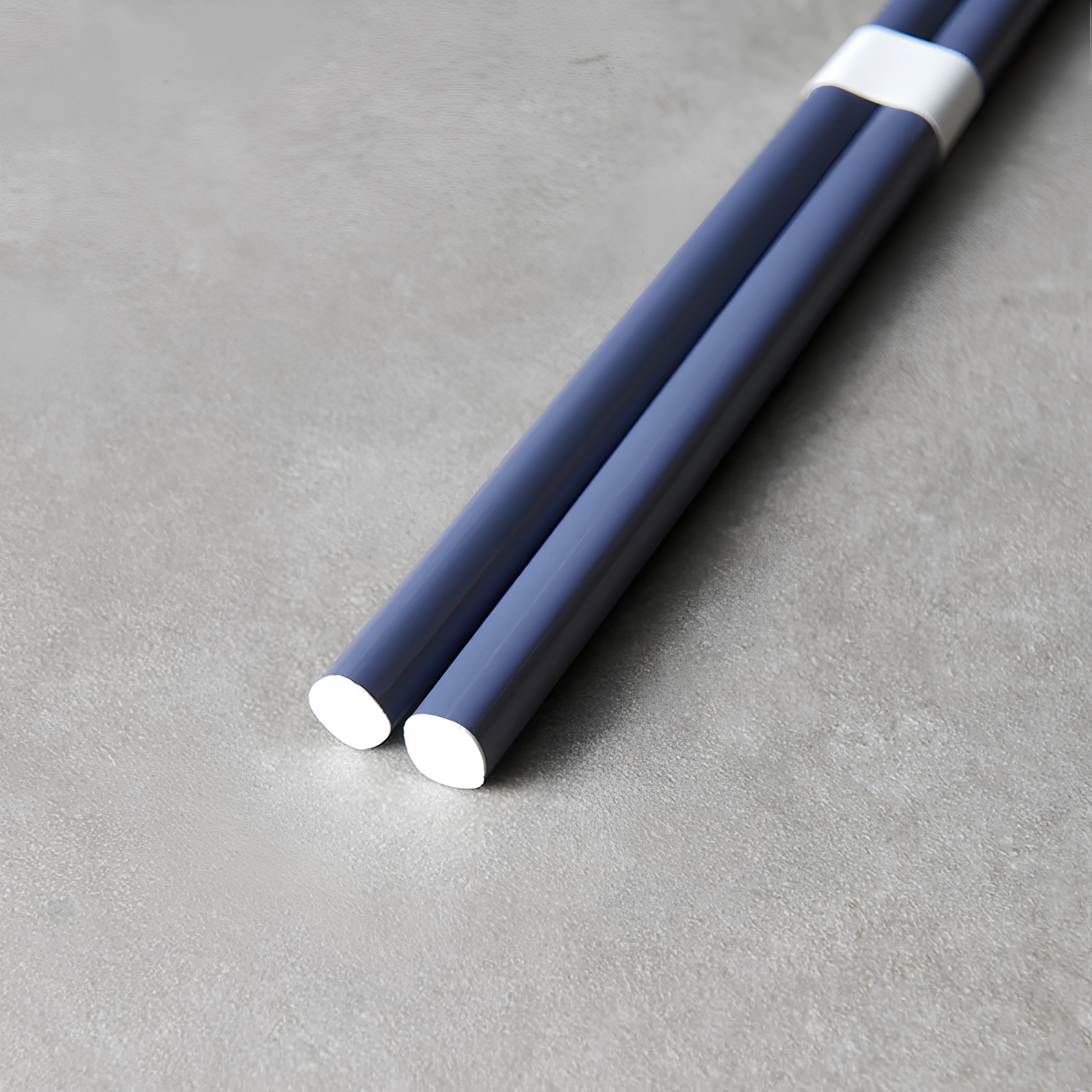 Close up on the bottom part of the Fathom Chopsticks Pair Lacquered Navy blue rich finish with subtle white accent.