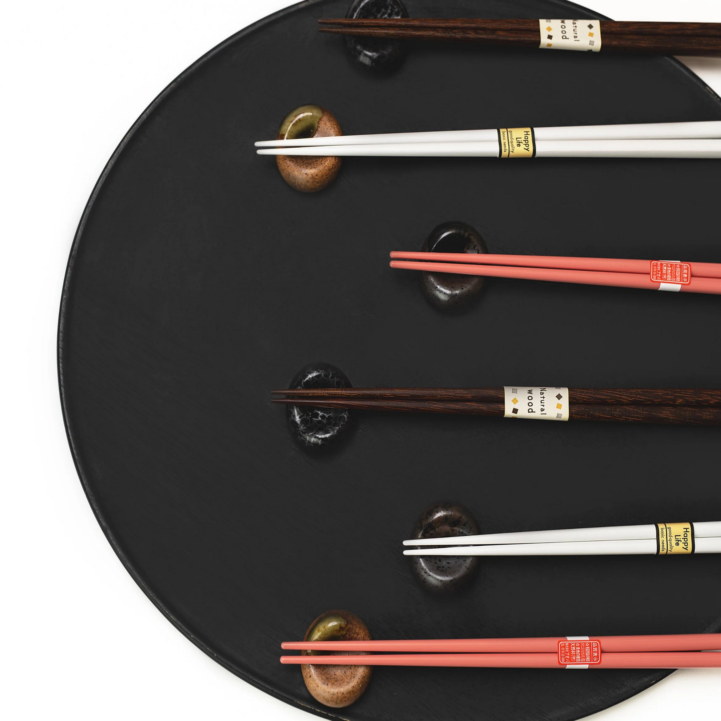 White and brown with Fathom Chopsticks Pair Lacquered Pink soft finish with sleek white accent, rested on each chopstick rest.
