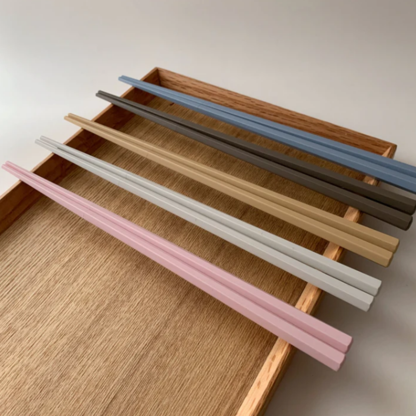 Full body view of the Fathom Tokyo Chopsticks Set of 5 - Pastel resin chopsticks, 23cm long, hexagonal shape with matte non-slip finish, lightweight, dishwasher safe.