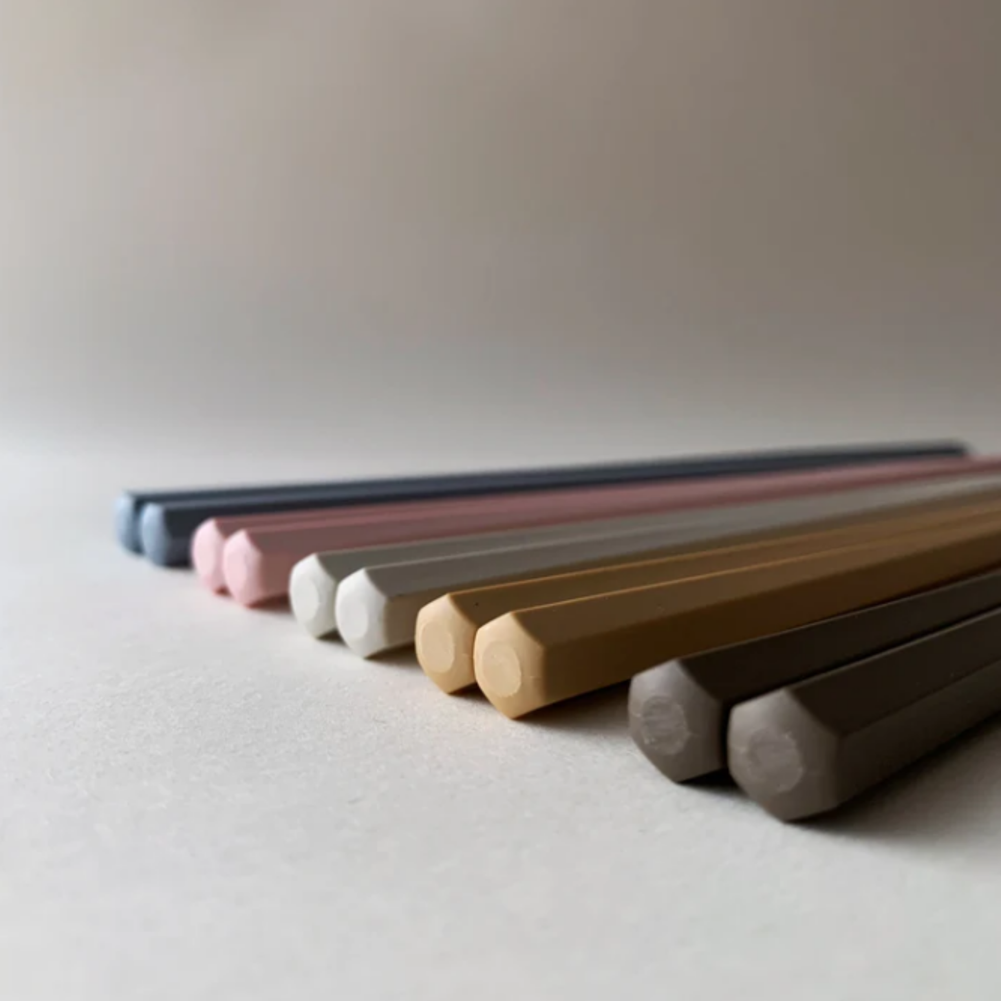 Showing the hexagonal shaped bottom of the chopsticks from Fathom Tokyo Chopsticks Set of 5 - Pastel resin chopsticks, 23cm long, hexagonal shape with matte non-slip finish, lightweight, dishwasher safe.