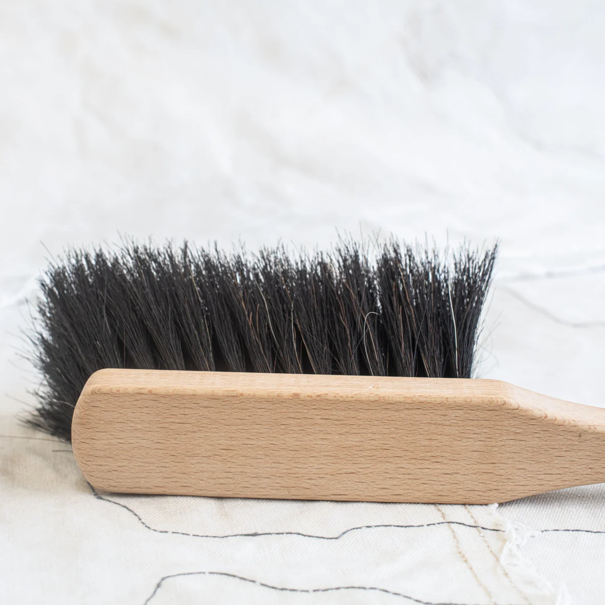 Back view of Fathom Horse Hair Hand Dust Brush - German-made 29x4x7cm beech wood handle with natural waxed finish, pure horsehair bristles in black or light beard, durable eco-friendly cleaning brush, ideal for pairing with elegant dustpans.