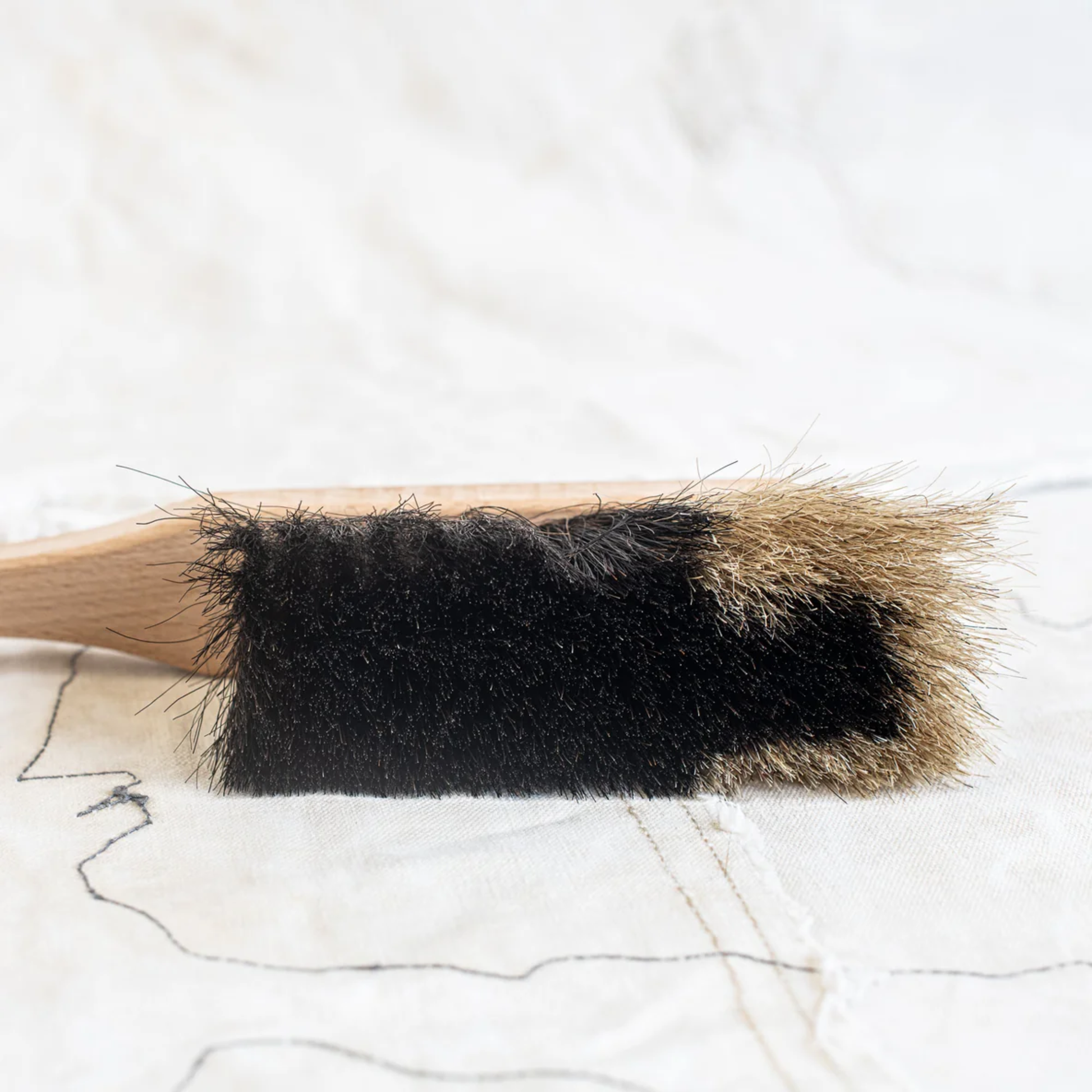 Brush view of Fathom Hand Brush Horse Hair Two Tone, German-made beech wood handle, black or light horsehair, hand-held cleaning brush.