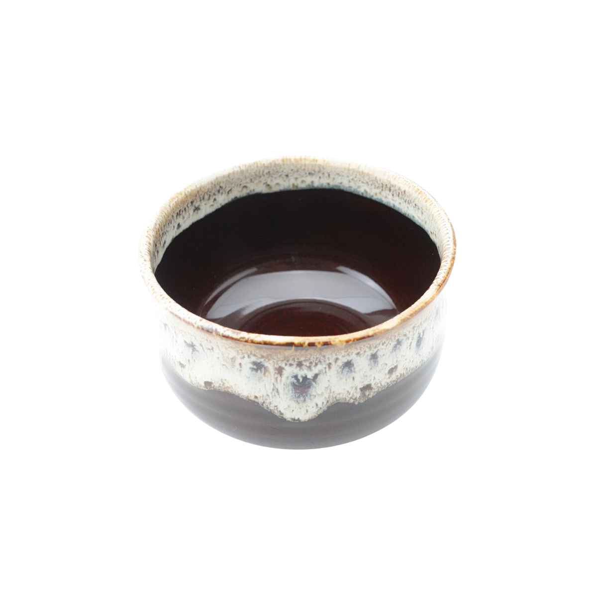 Semi top view of the Fathom Japanese Hasami Ware Matcha Bowl in amber, ceramic with textured finish, compact lightweight design for casual matcha.