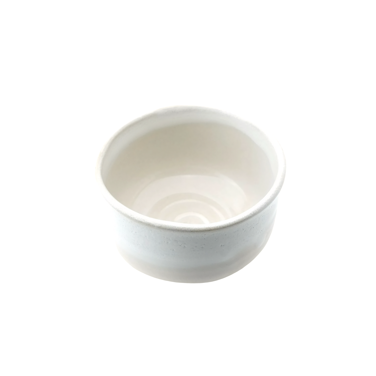 Semi top view of Fathom Japanese Hasami Ware Matcha Bowl in white, ceramic with textured finish, compact lightweight design for casual matcha.