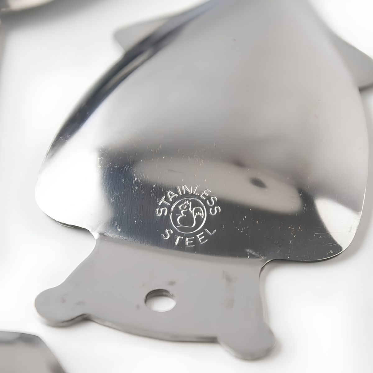 Back part of Fathom Japanese Mini Squid Grater White Ceramic, squid-shaped design for grating small amounts of salt, ginger, and wasabi.
