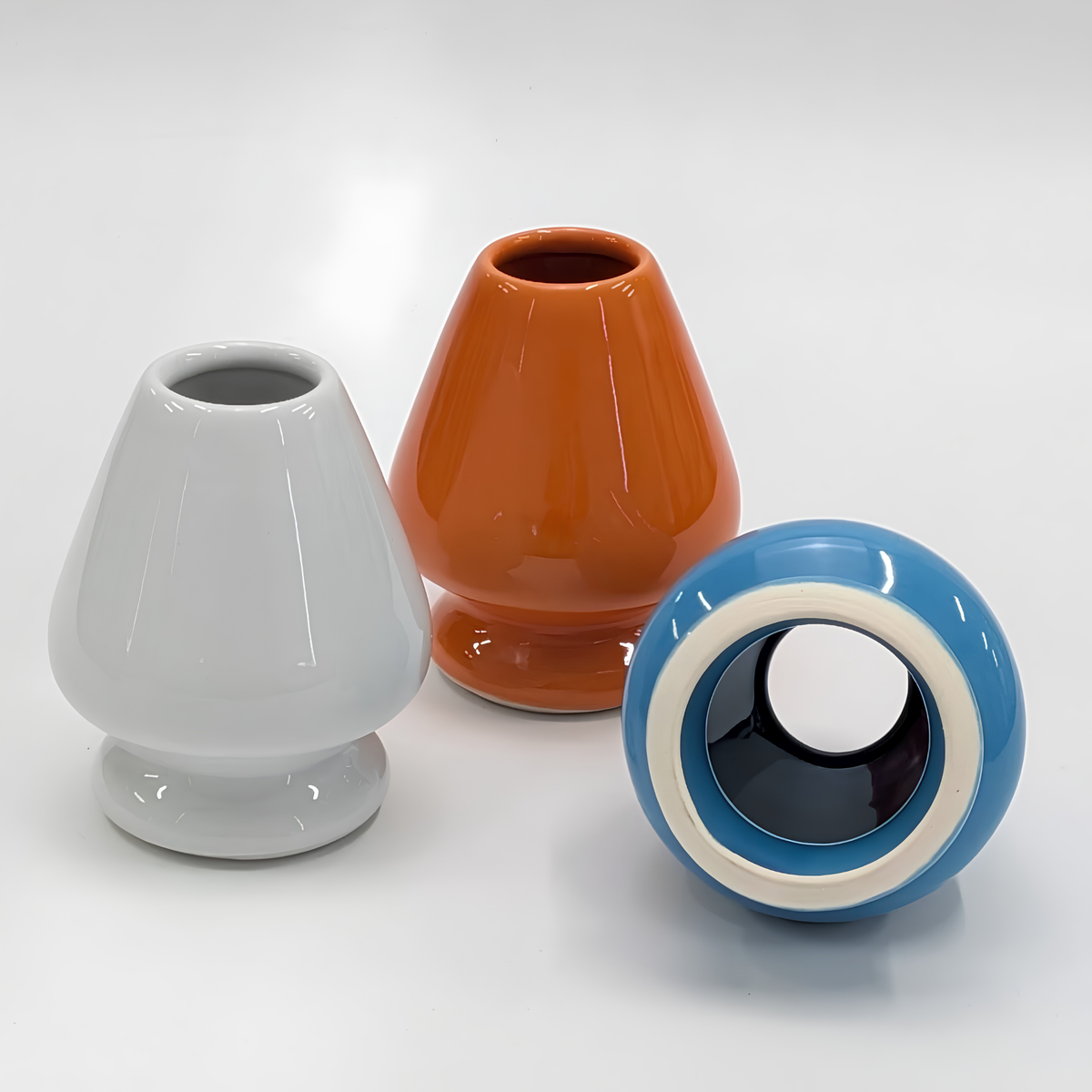 Fathom Japanese Mino Ware Matcha Whisk Stand White Ceramic, preserves Chasen shape after washing, shown standing with color orange and blue variant lying down.