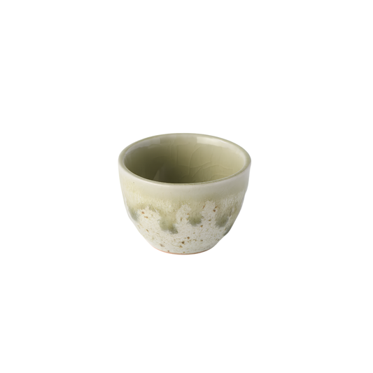 Semi top view of Fathom Japanese Sake Cup in light green and cream, handcrafted ceramic with drip glaze, rounded shape and 30ml serving capacity.