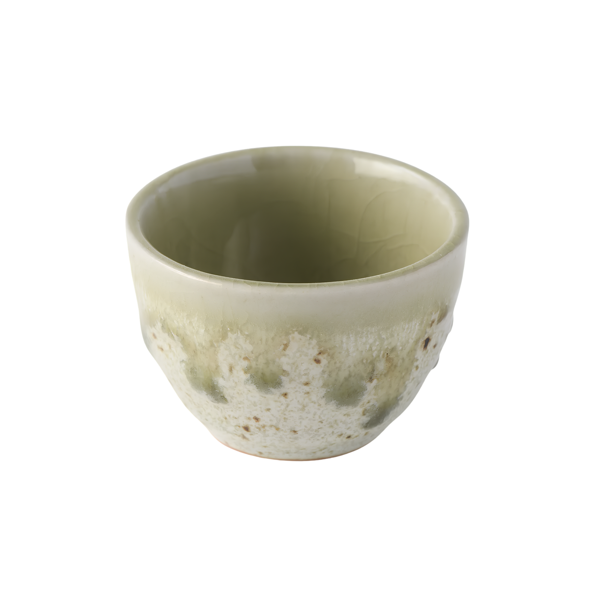 Close up semi top view of Fathom Japanese Sake Cup in light green and cream, handcrafted ceramic with drip glaze, rounded shape and 30ml serving capacity.