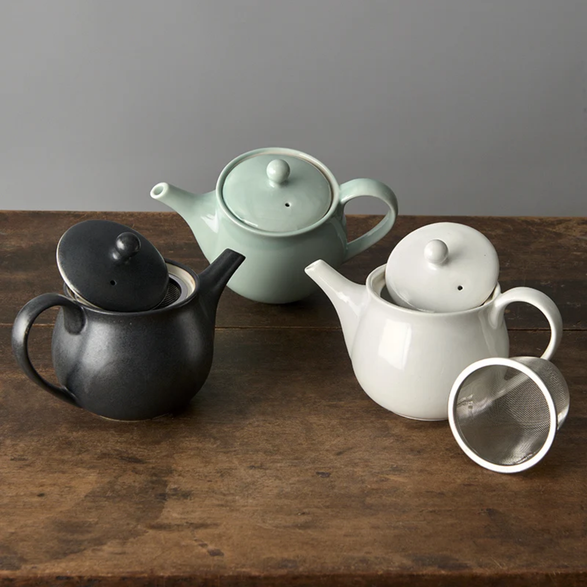 Sligthly open teapots with the Fathom Japanese Teapot in matt white, ceramic with stainless steel infuser, 400ml capacity and smooth-pouring spout.