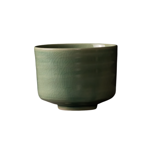 Side view of the Fathom Matcha Tea Bowl 10cm Jade wit glaze that is smooth, glossy soft green with gentle natural colour.