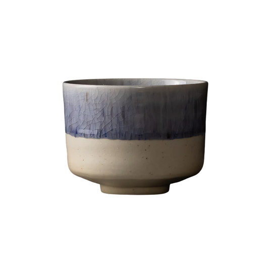 Side view of the Fathom Matcha Tea Bowl 10cm Winter Drift featuring a soft indigo glaze and a delicate speckled texture subtle crackle finish.