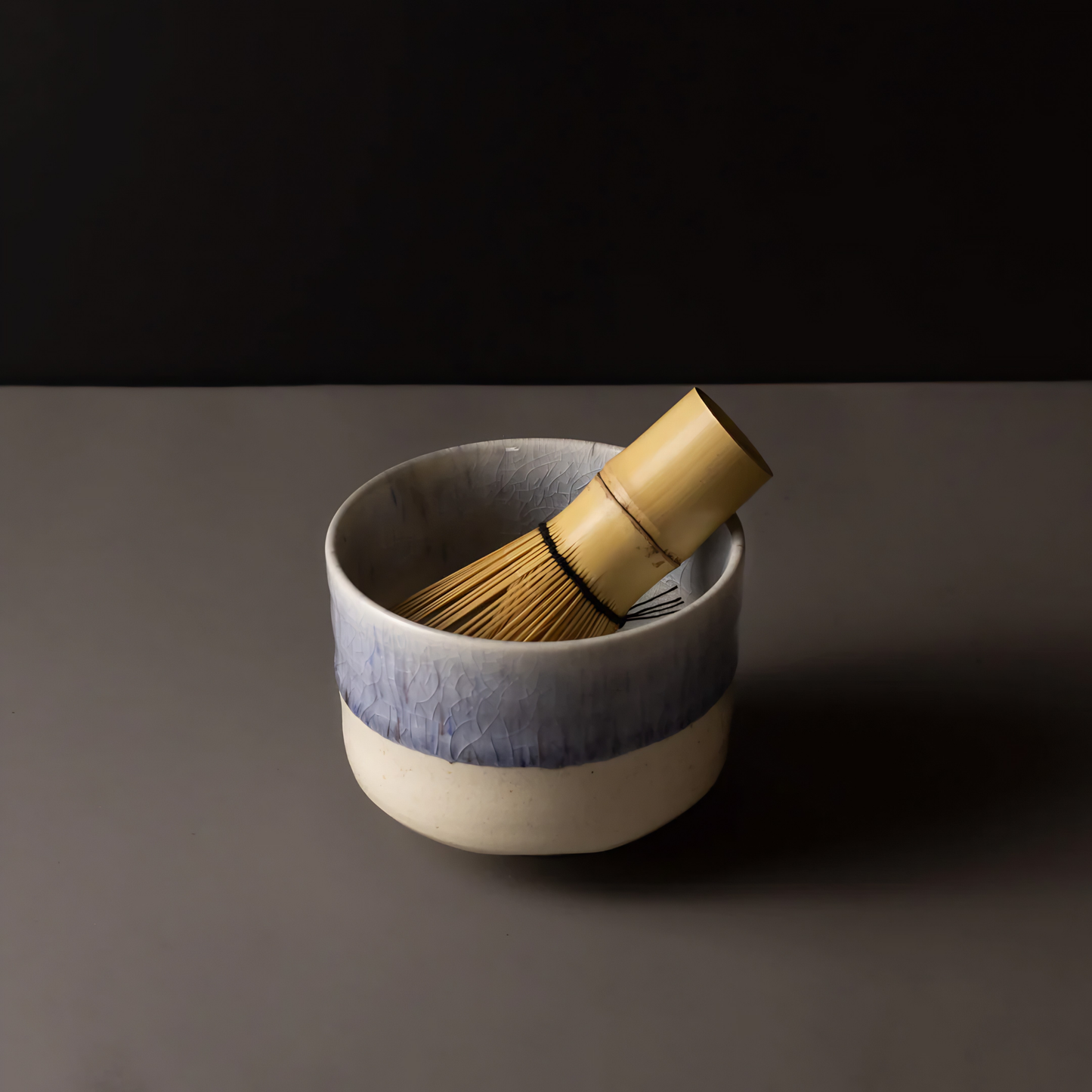 Seen inside a bowl, the Fathom Matcha Whisk Bamboo 100 Prong, Chasen handcrafted from a single bamboo into delicate bristles making it as whisk
