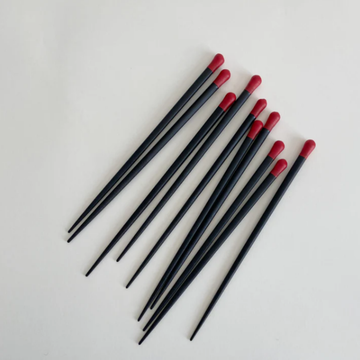 Fathom Matchstick Chopsticks Set of 5 - Red and natural resin chopsticks, 22cm long, lightweight non-slip design, dishwasher safe.