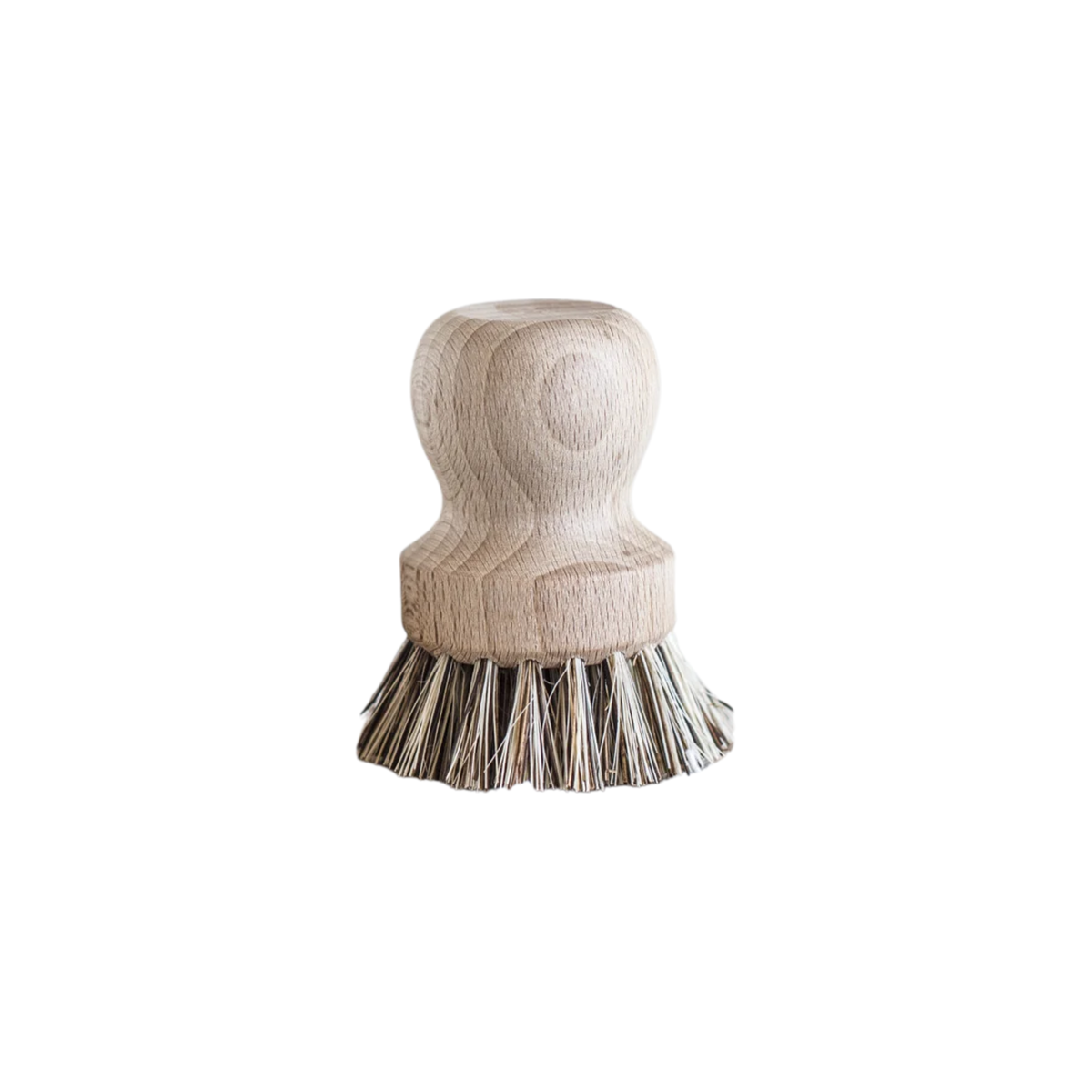 Upside down view of Fathom Pot Brush Tampico and Palmyra Fibre- Raw beechwood brushes with stiff bristles rest on textured fabric.