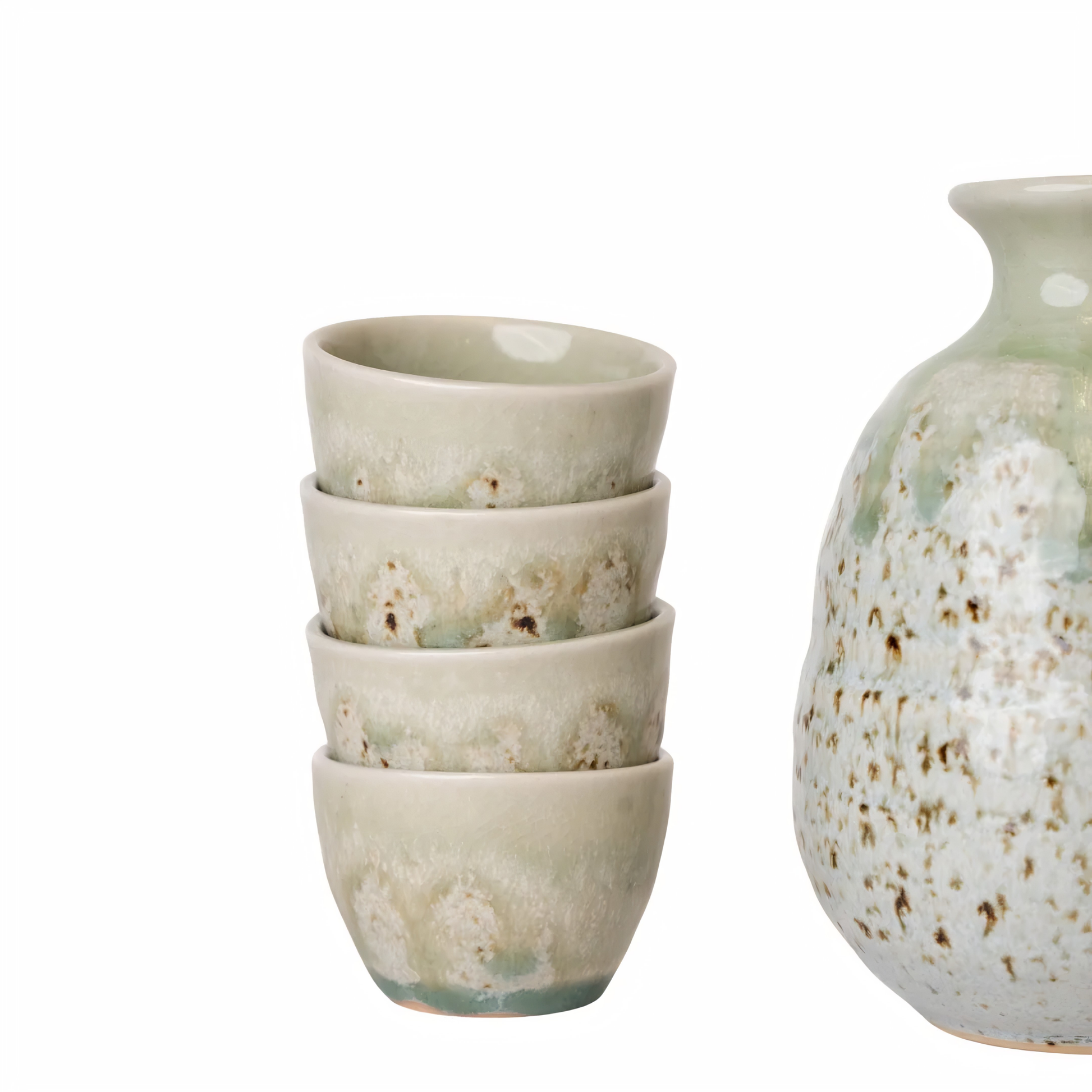 Close up on the four 50ml cups from Fathom Sake Set for Four 280ml Green Drip Glaze, packaged in a sleek gift box