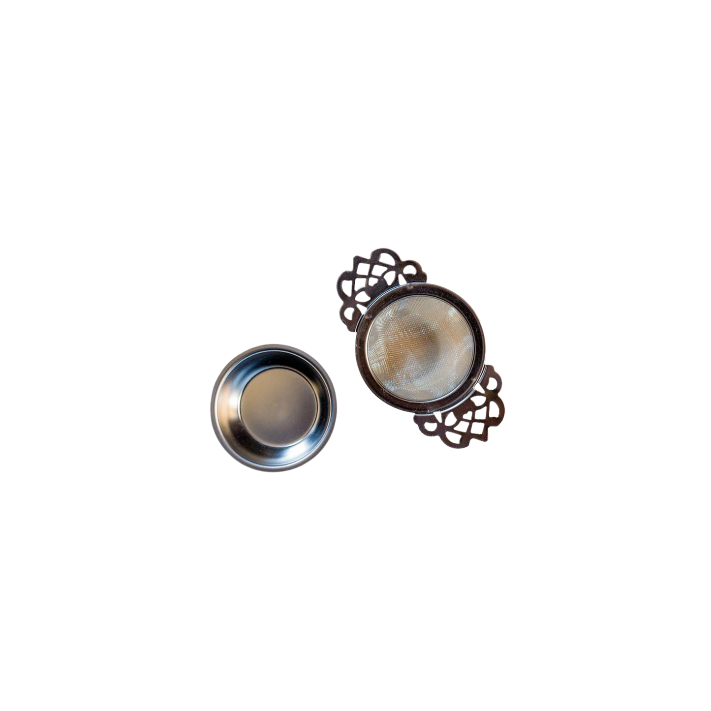 Tea strainer and drip tray side by side top view