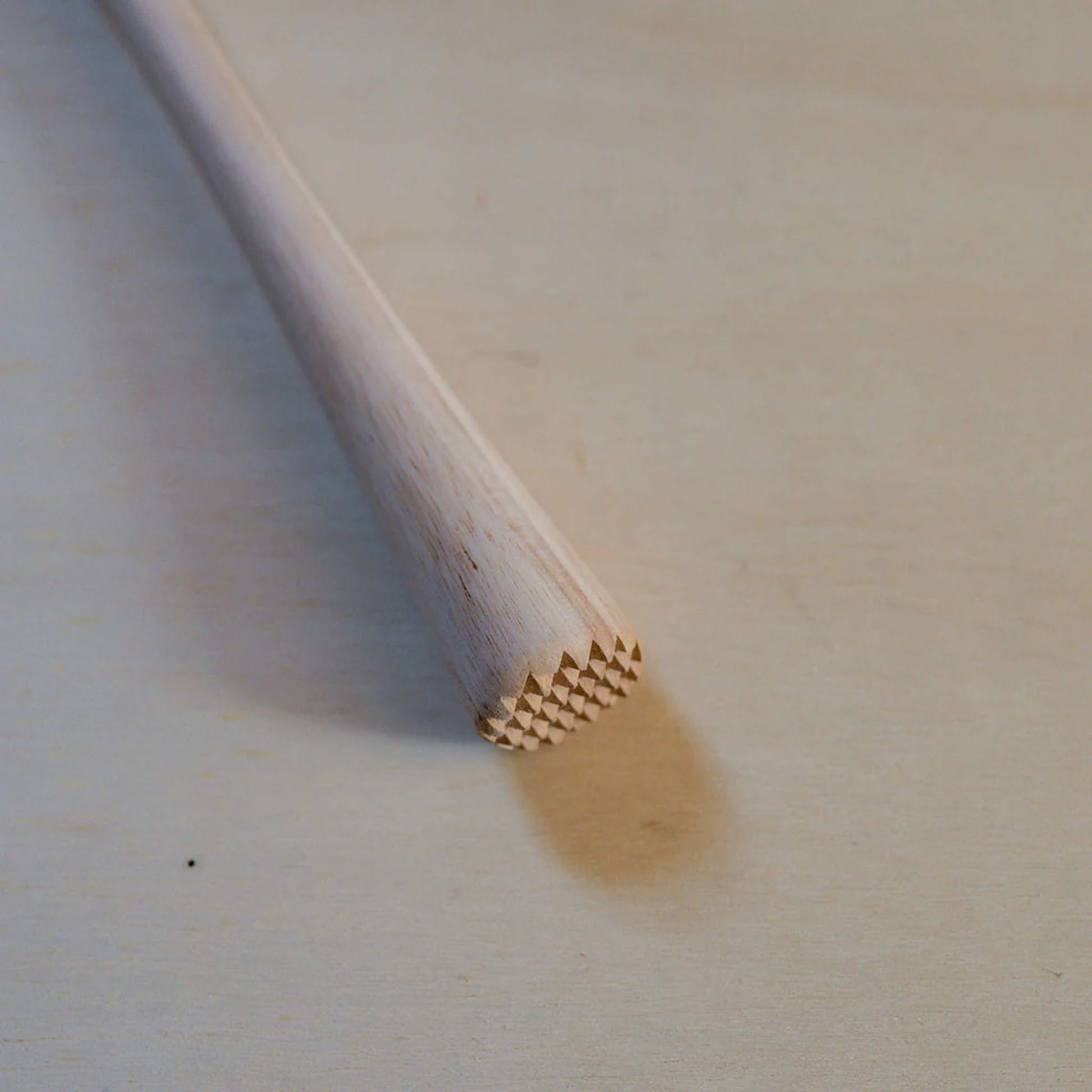 Close up of cocktail wooden muddler