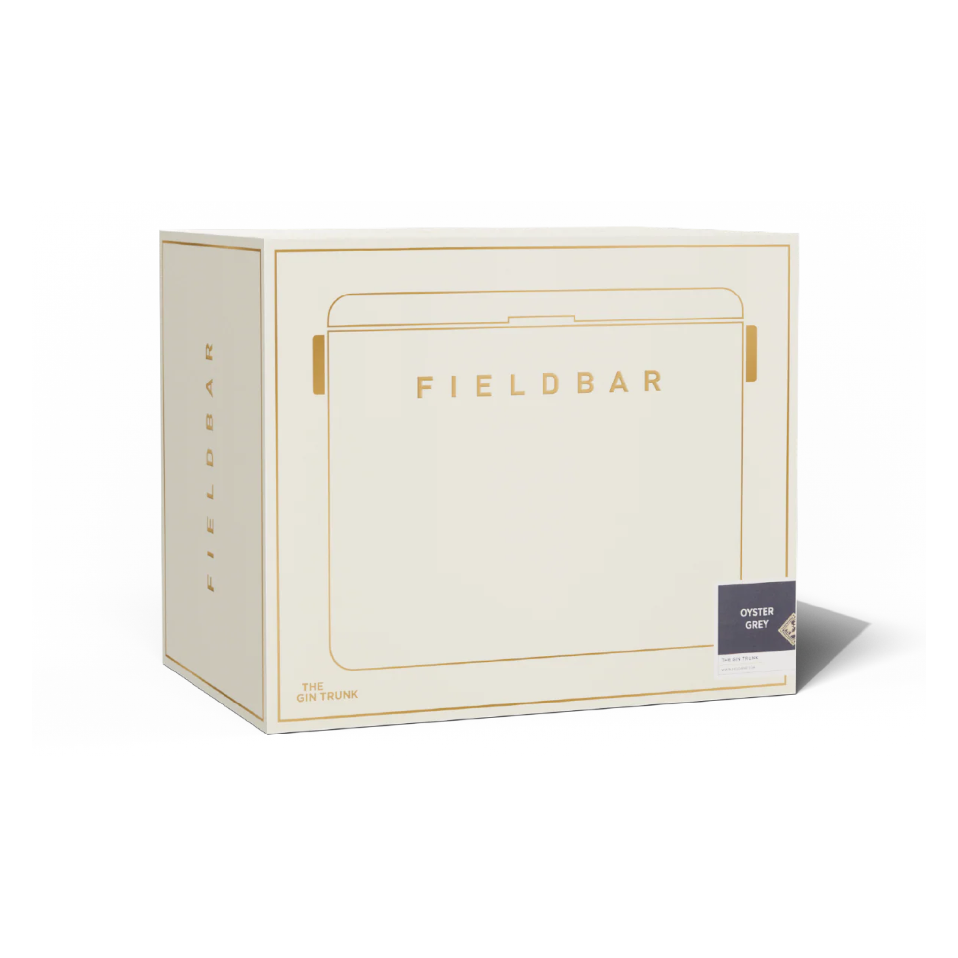 White-gold box packaging of Fieldbar Gin Trunk hardcase cooler - oyster grey insulated box made with impact-resistant plastic, aluminium hardware, leather-wrapped handle, and BPA-free interior; 24L capacity with 50-hour champagne-cold performance.