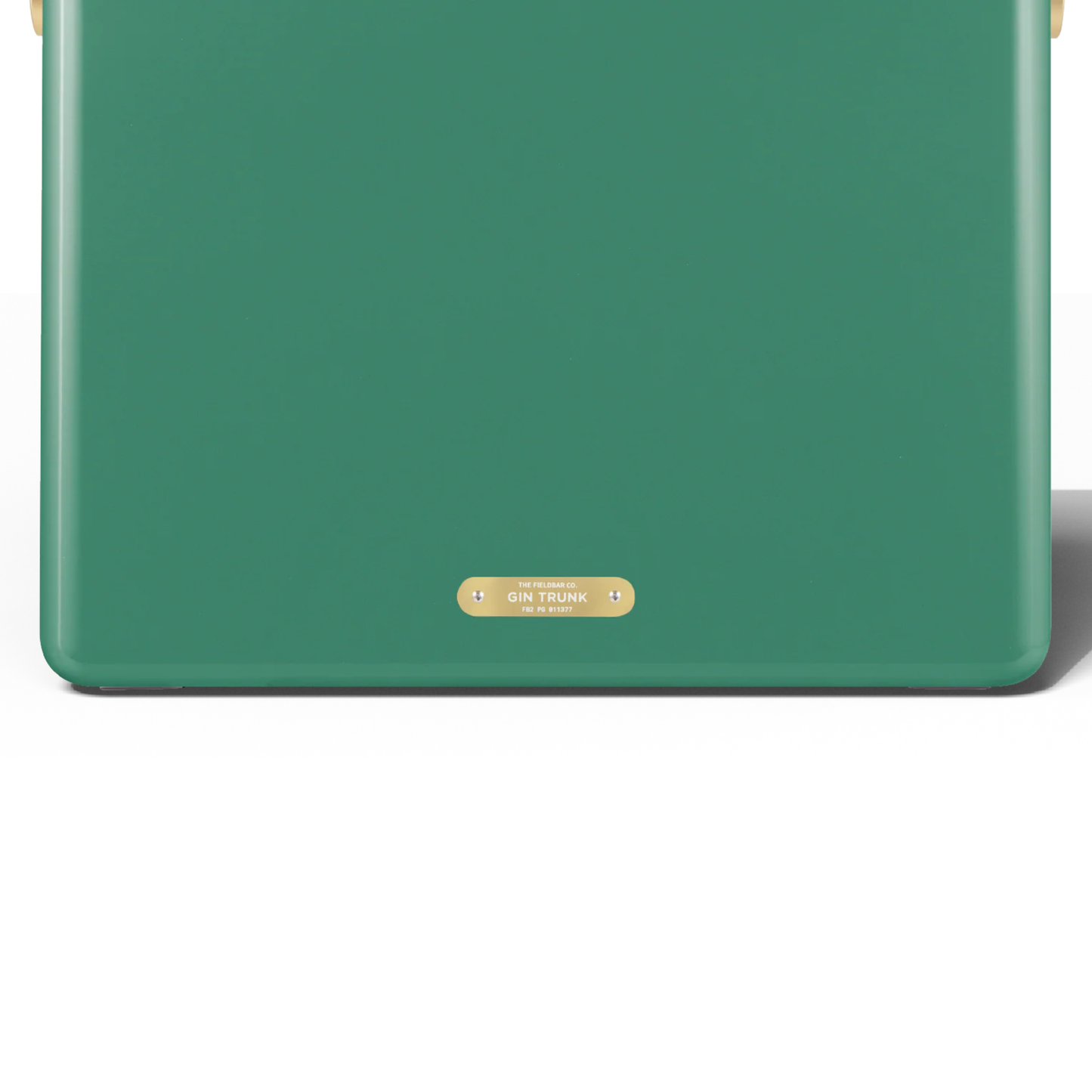Upclose back view with the badge with the Gin Trunk writing from FIELDBAR Gin Trunk Parisian Green - premium hardcase cooler box in impact-resistant material with genuine leather handle wrap, extruded aluminum handle, reflective paint, airtight gasket, BPA-free interior, and 24L capacity for keeping drinks cold up to 50 hours.