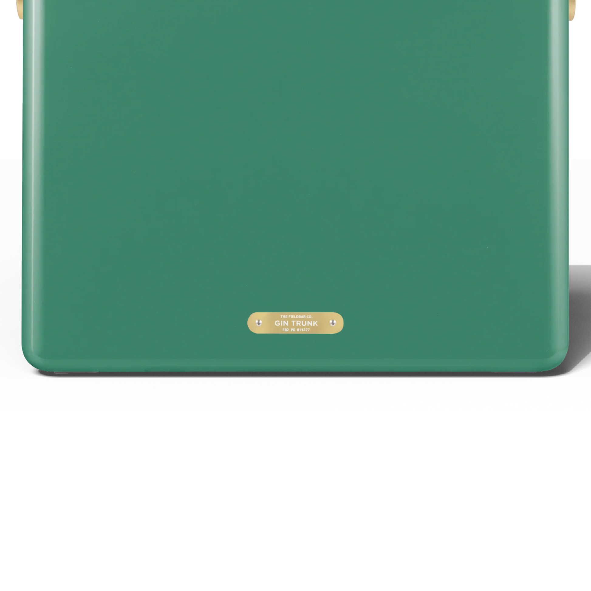 Upclose back view with the badge with the Gin Trunk writing from FIELDBAR Gin Trunk Parisian Green - premium hardcase cooler box in impact-resistant material with genuine leather handle wrap, extruded aluminum handle, reflective paint, airtight gasket, BPA-free interior, and 24L capacity for keeping drinks cold up to 50 hours.