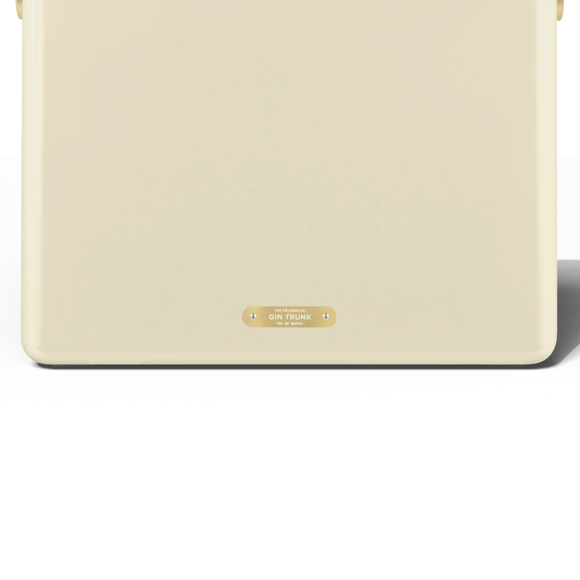 Upclose back view with the badge that has a Gin trunk writing from FIELDBAR Gin Trunk Safari White - premium hardcase 24L insulated cooler box in white impact-resistant material with leather-wrapped handle, extruded aluminum carry handle, reflective heat-reducing finish, airtight water- and air-sealed gasket, BPA-free interior, removable high-performance insulation, and 50-hour ice retention.