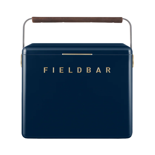 Front view of FIELDBAR Gin Trunk Sea Boat Blue - premium hardcase 24L insulated cooler box in blue impact-resistant material with leather-wrapped handle, extruded aluminum carry handle, reflective heat-reducing paint, airtight water- and air-sealed gasket, BPA-free easy-clean interior, removable high-performance insulation, and 50-hour ice retention.
