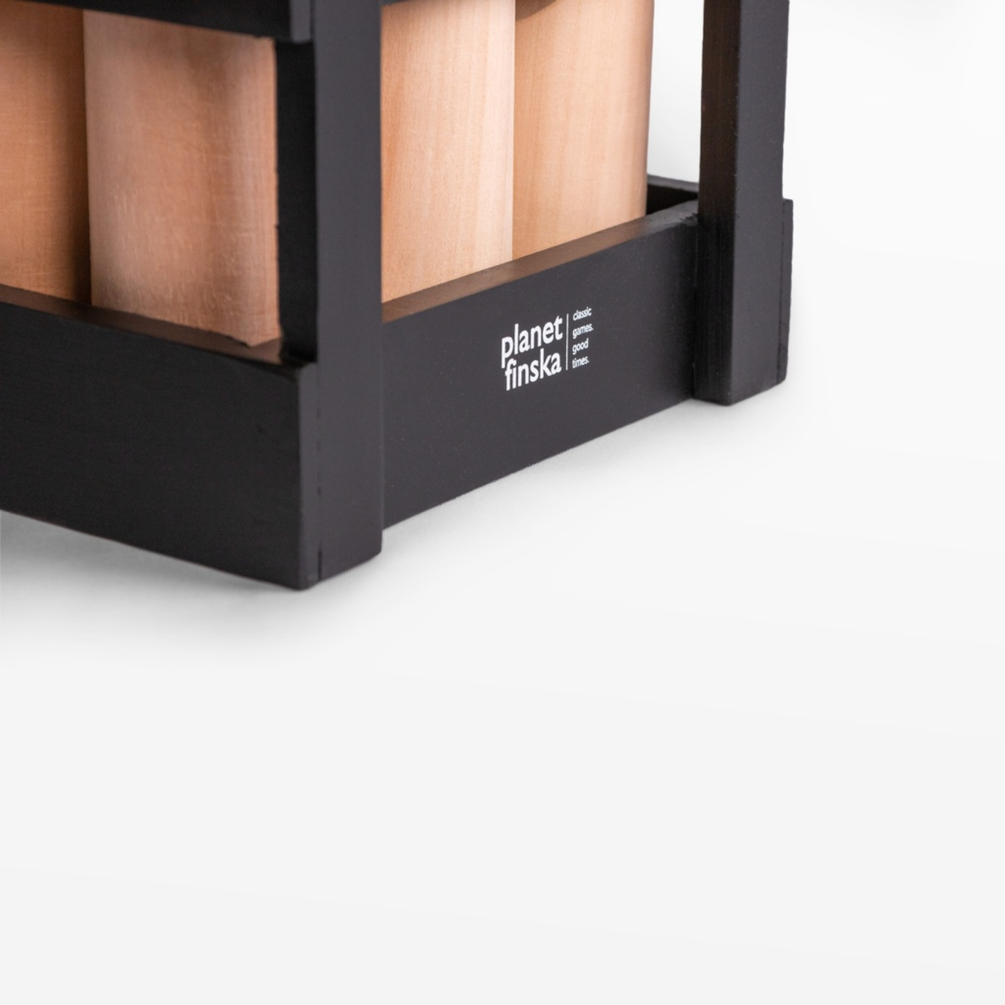 Right side view of Finska in Charcoal Black outdoor throwing game set made from eco-friendly birch hardwood, includes 12 numbered pins, a throwing log, and a black painted carry crate.