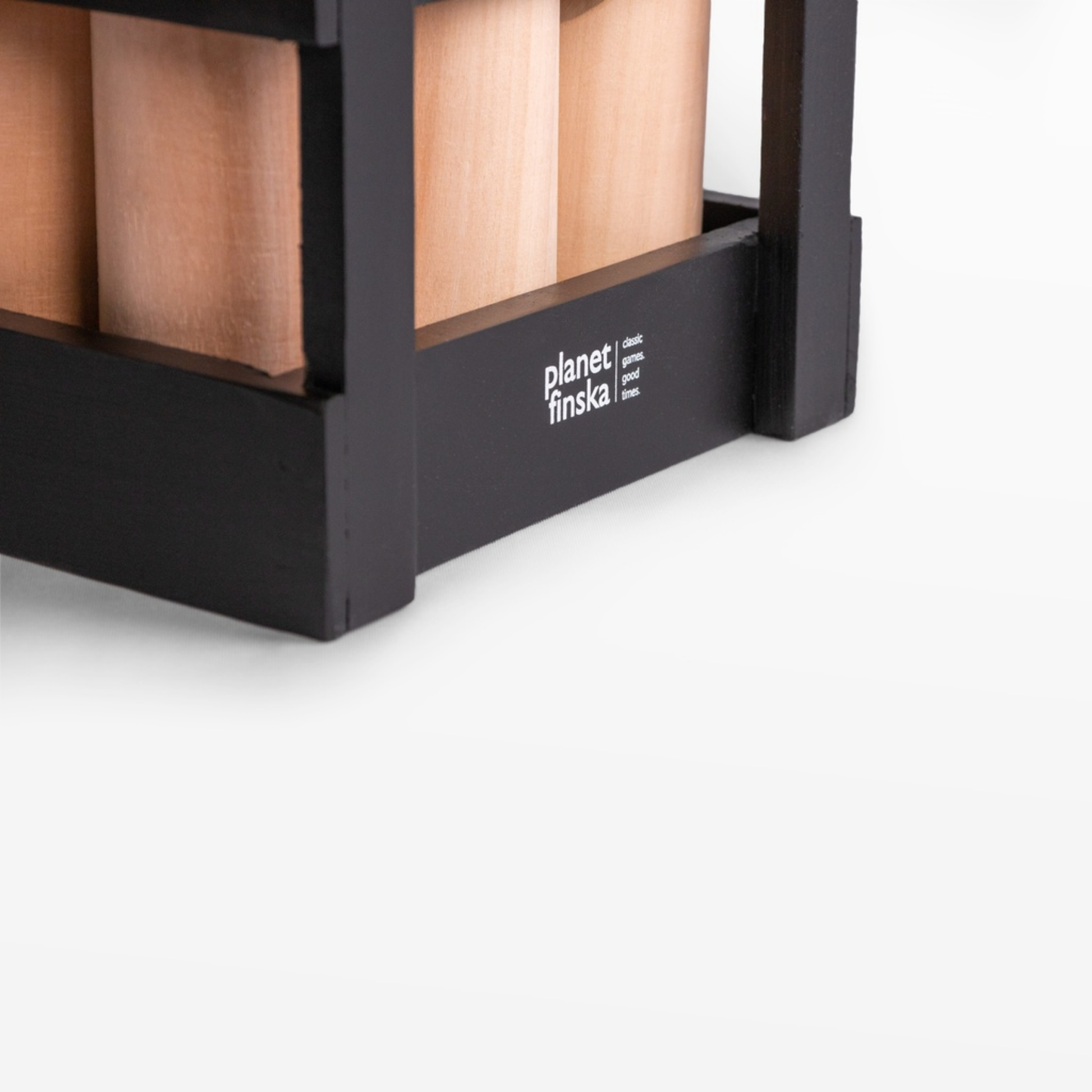 Right side view of Finska in Charcoal Black outdoor throwing game set made from eco-friendly birch hardwood, includes 12 numbered pins, a throwing log, and a black painted carry crate.