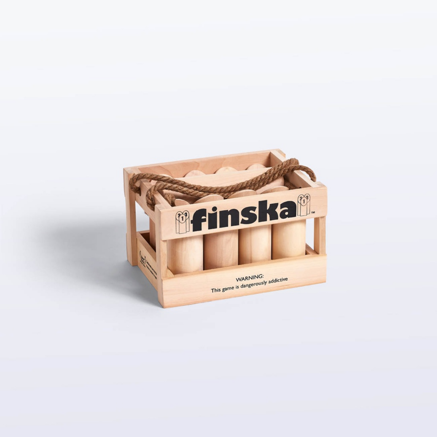 Front view of Original Finska natural birch outdoor throwing game set, includes 12 numbered pins, a Finska throwing log, birch carry crate, rule card, and score sheet. Traditional Finnish lawn game promoting strategy, skill, and fun for all ages.