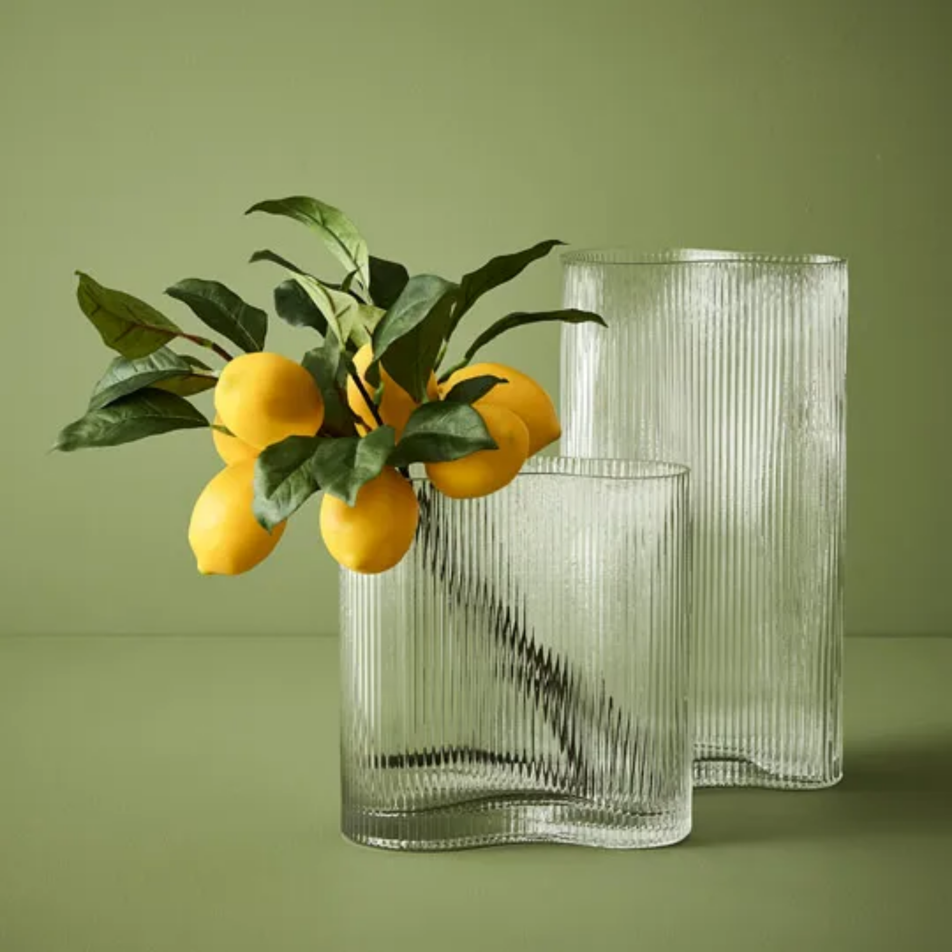 Floral Interiors Ripple curve vase with lemon branches on display inside