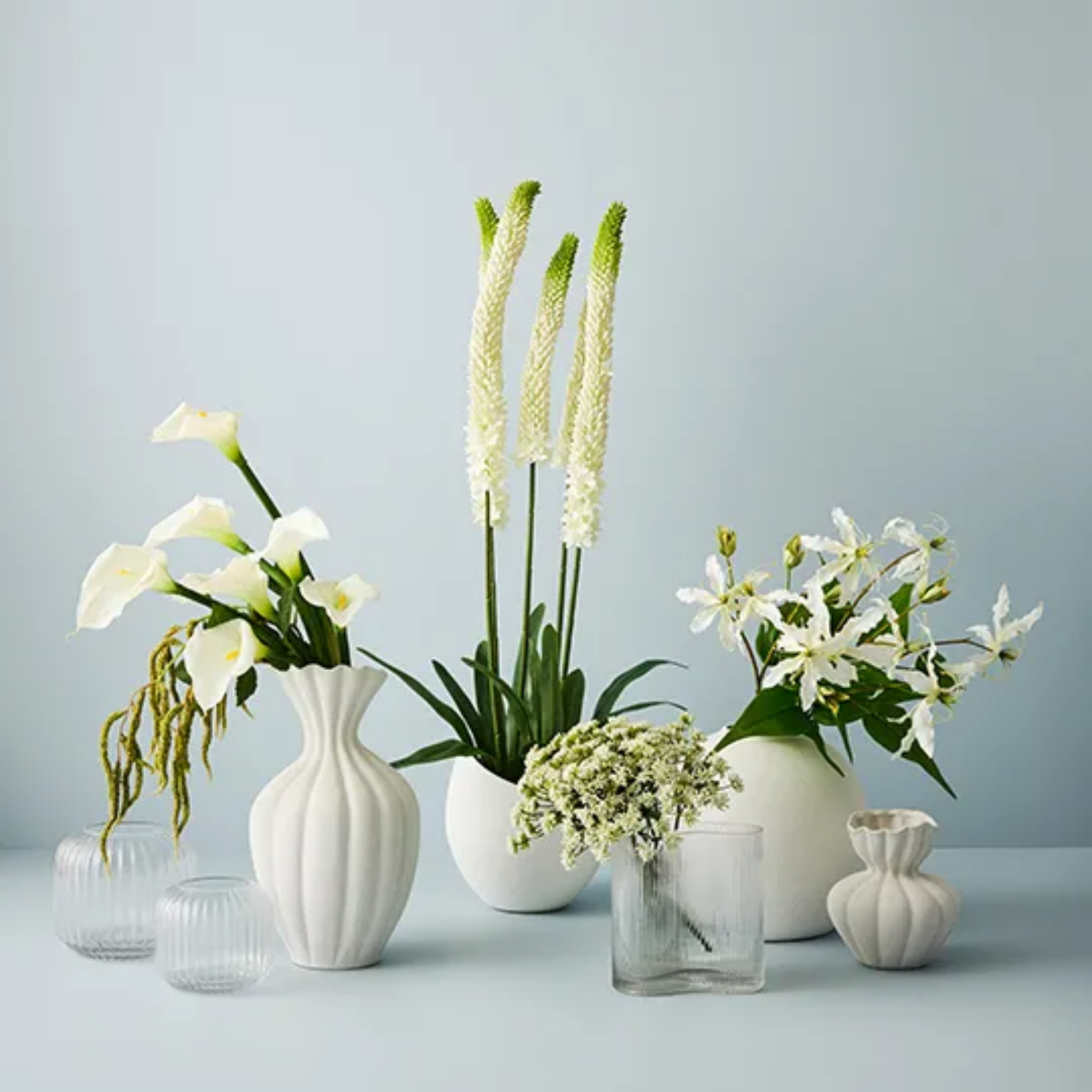 Floral Interiors Ripple curve vase on display with flowers in vases