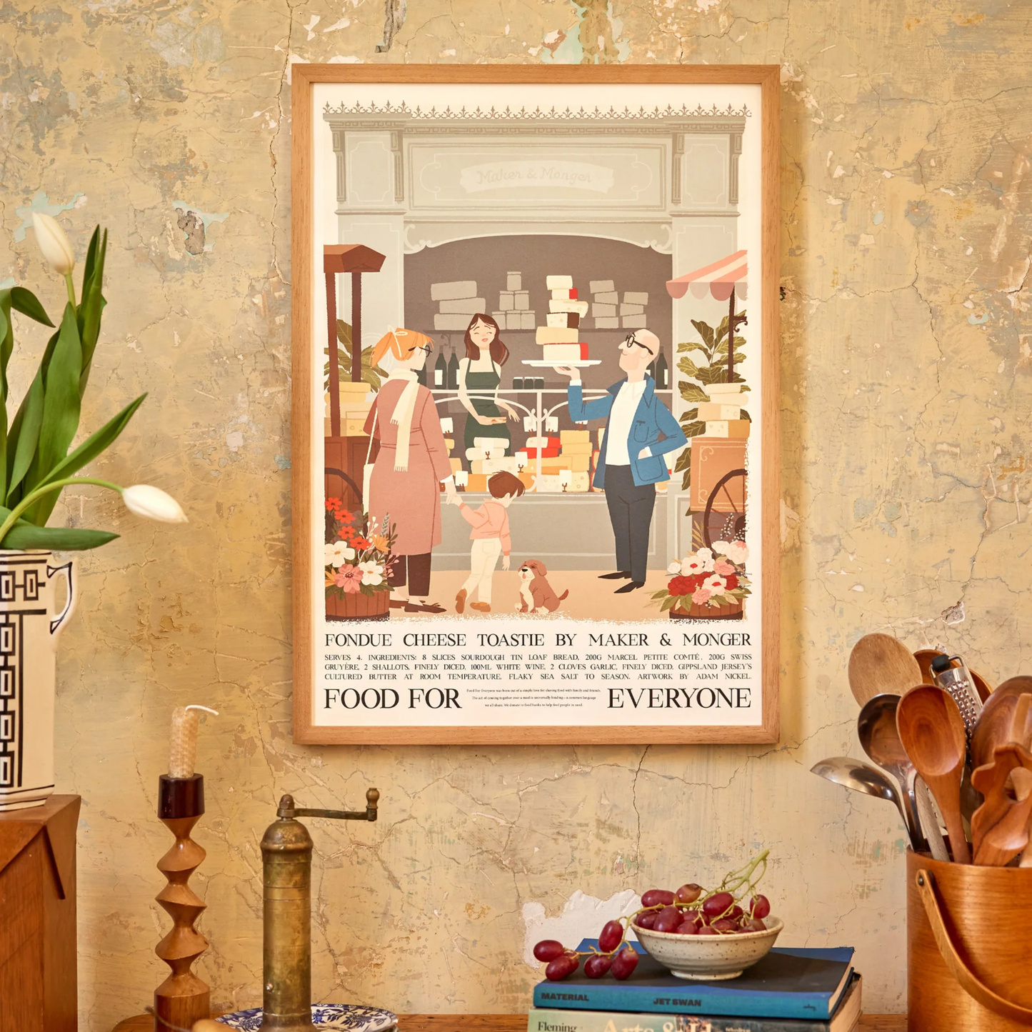 Food For Everyone Poster A2 Fondue Cheese Toastie featuring an illustration of a market featuring different cheeses, hung on the wall.
