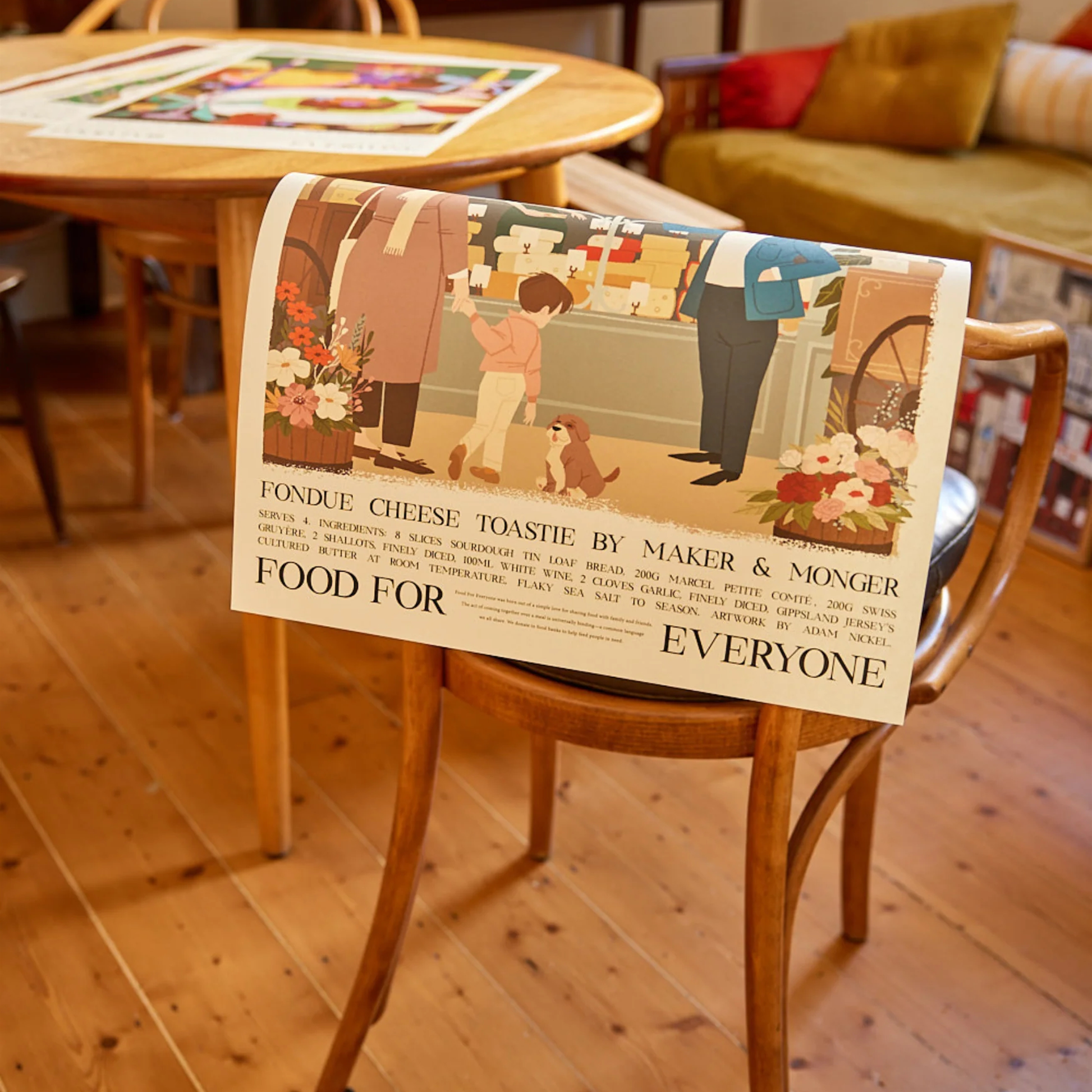 Food For Everyone Poster A2 Fondue Cheese Toastie featuring an illustration of a market featuring different cheeses, resting on a chair.