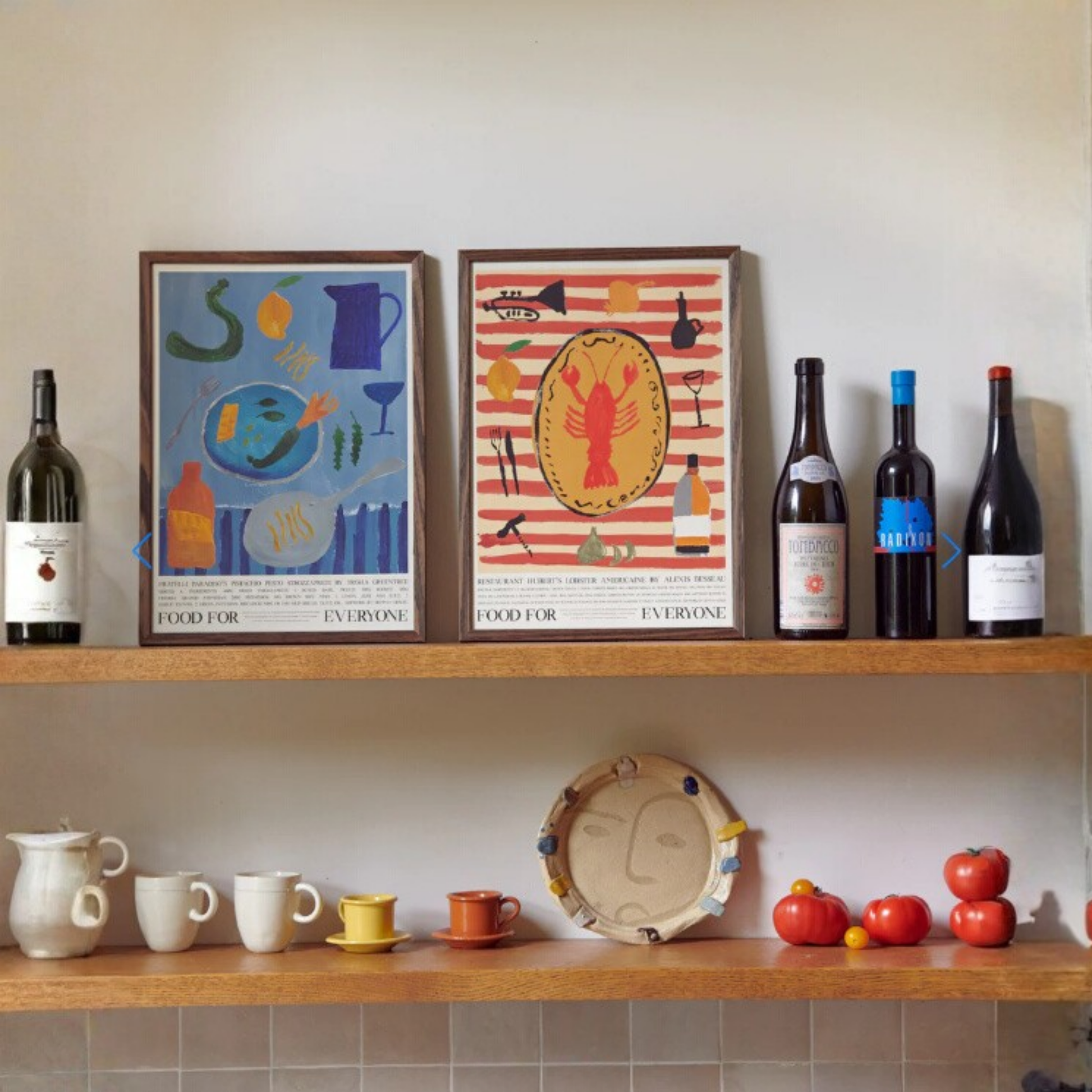 Shown on a wine shelf Food for Everyone Fratelli Paradiso Pistachio pesto strozzapreti Poster in calming blue tones by Gemma Leslie, inspired by Trisha Greentree's Pistachio Pesto Strozzapreti recipe; printed on recycled coffee cup paper, unframed