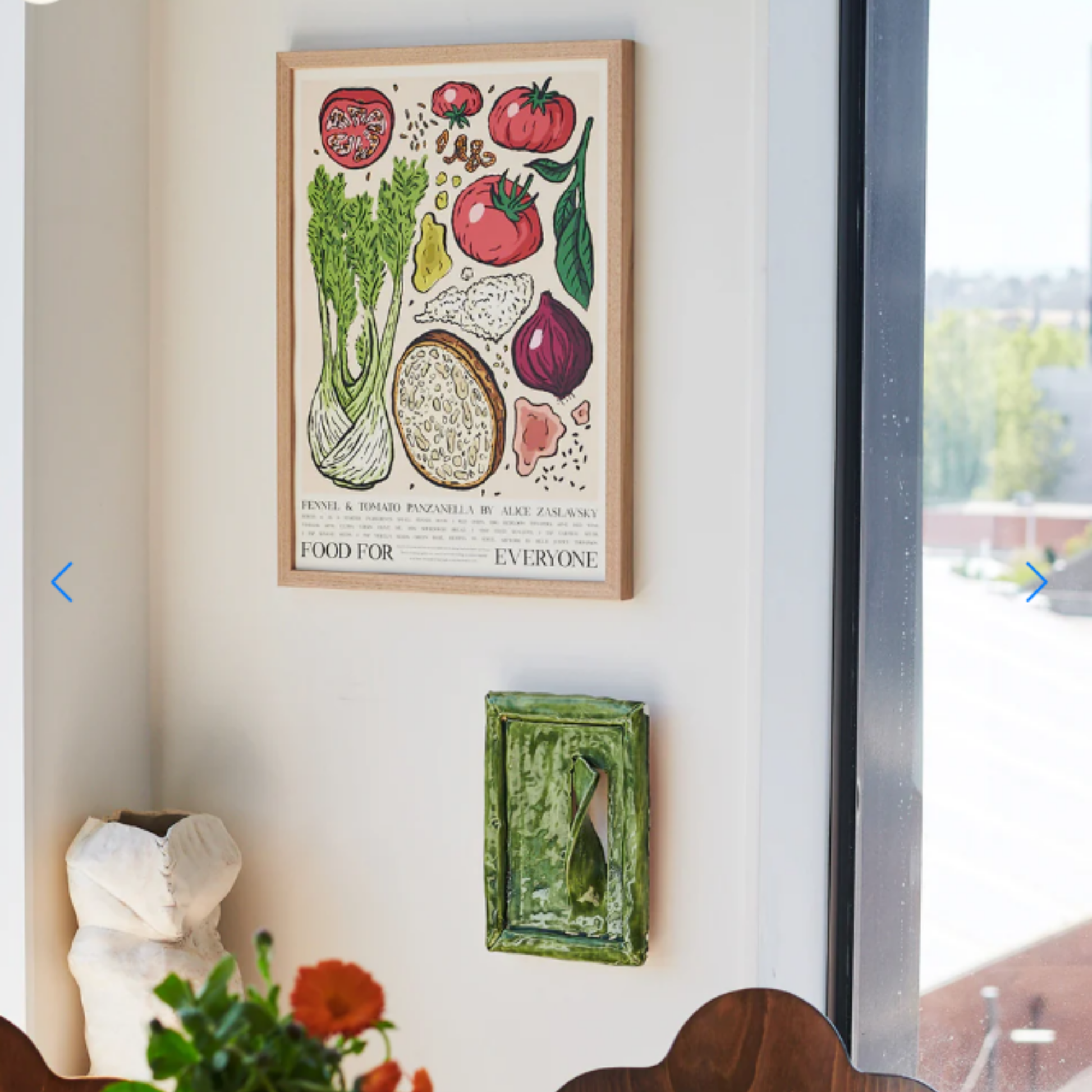Hung on the wall Food for Everyone Limited Edition Fennel and Tomato Panzanella Poster A2 printed on recycled coffee cup paper, featuring Billie Justice Thomson's colorful artwork inspired by Alice Zaslavsky's vibrant cooking; unframed