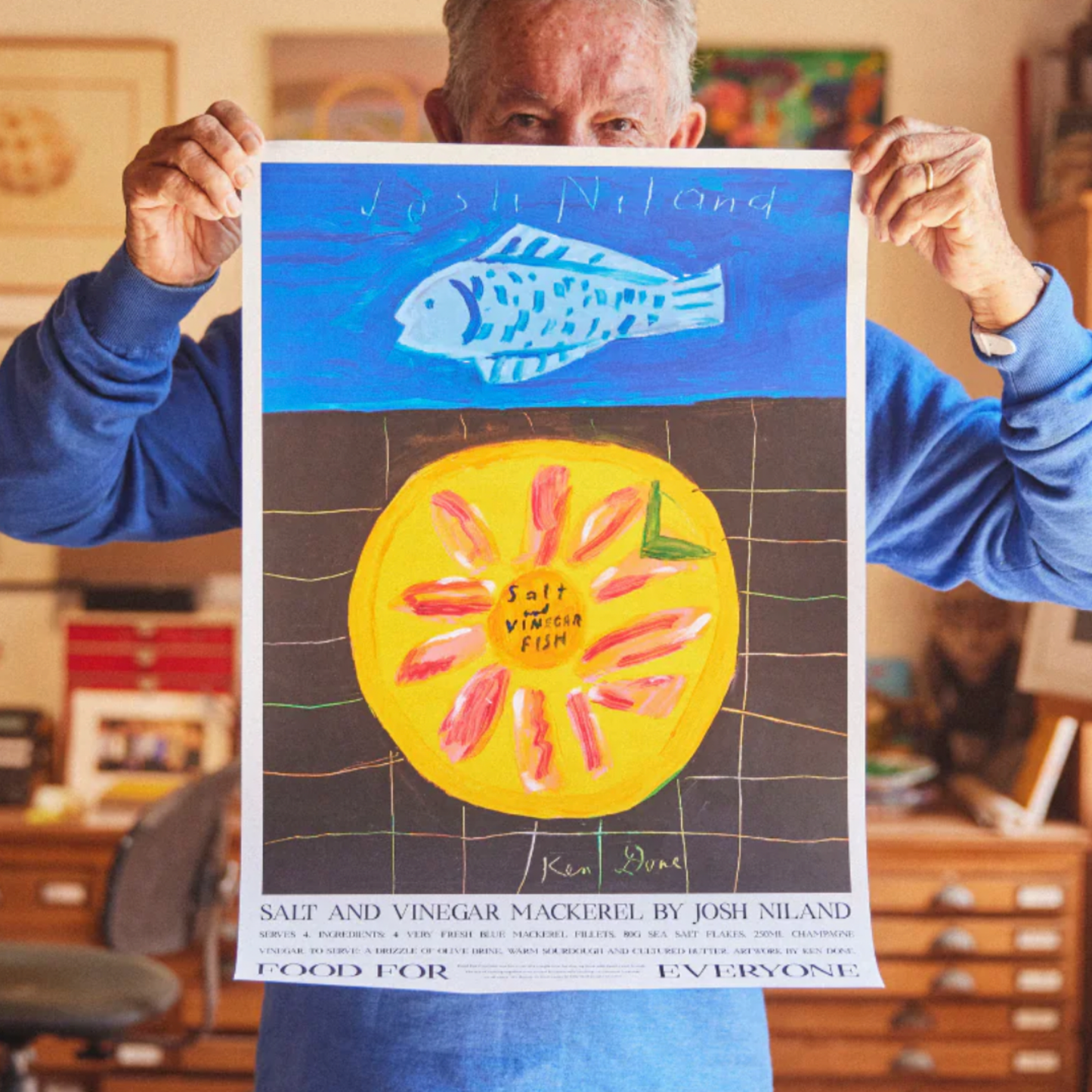 Food For Everyone Salt and Vinegar Fish artwork A2 front view being held up by man in studio