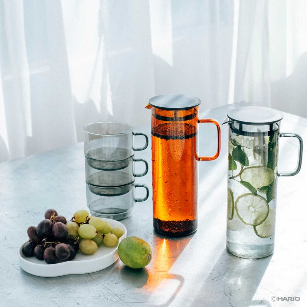 On the table with Hario Glass Pitcher Amber that is made from heatproof glass with 800ml capacity, with a lid that has a mesh filter.