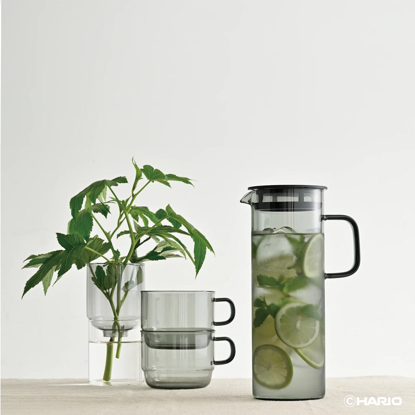 Stacked on the table Hario Glass Stacking Mug Grey that is made from heatproof glass, for 300ml capacity.