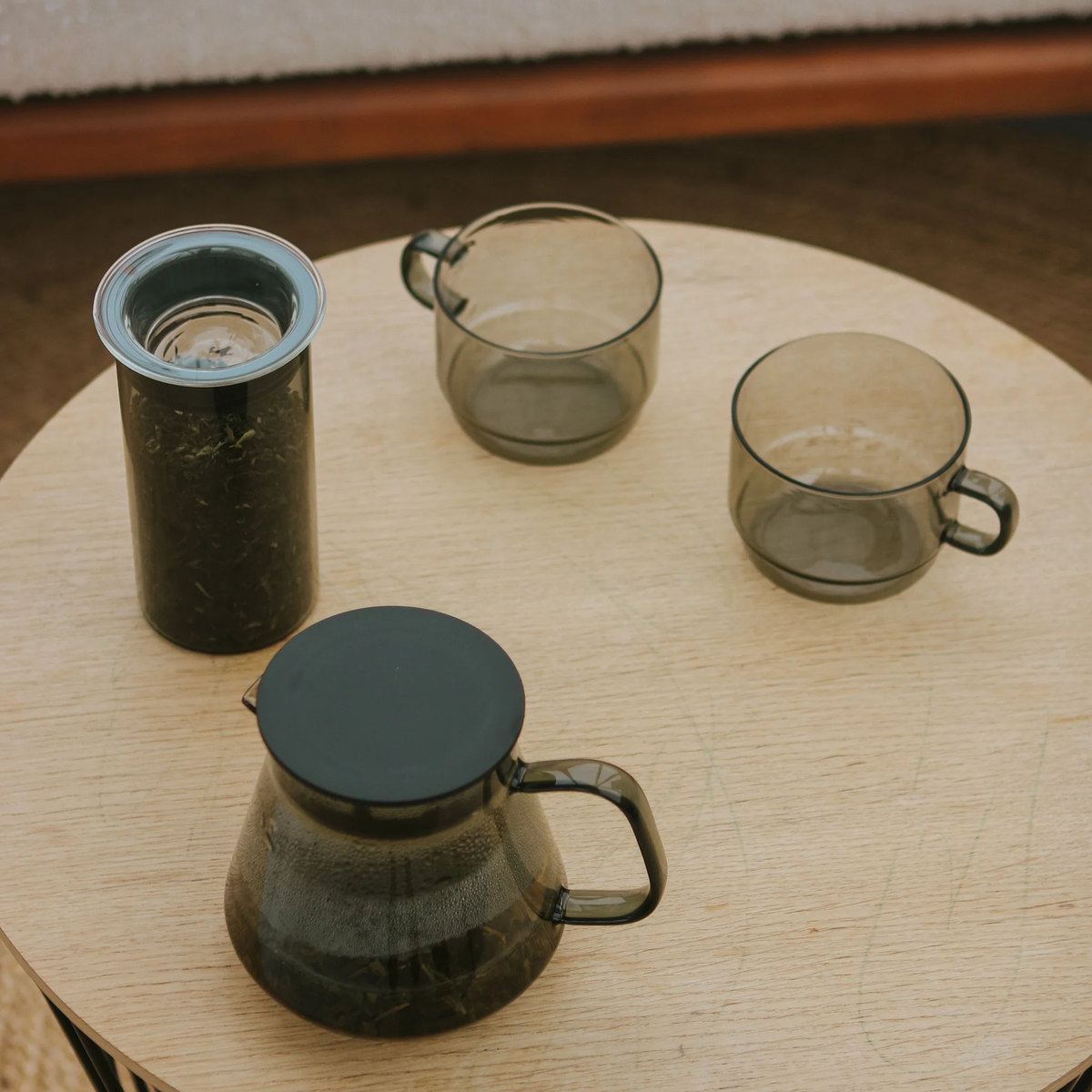 The Hario Glass Stacking Mug Grey on the table with a glass server, it is made from heatproof glass, for 300ml capacity.