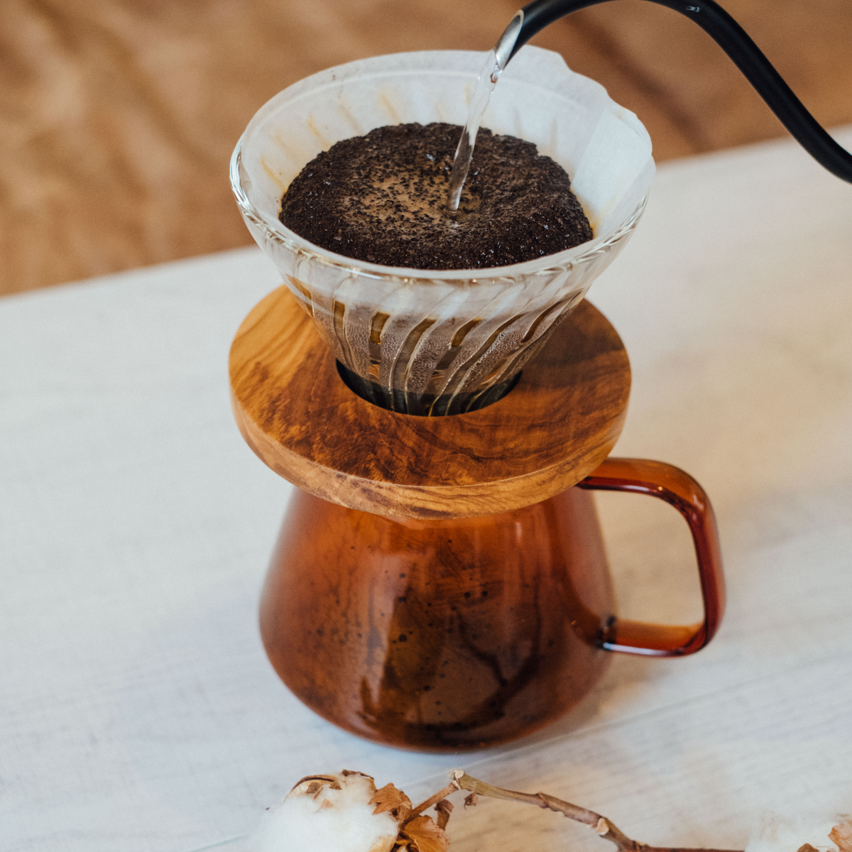 Dripping coffee to the Hario Glass Tea Server Amber which is made from heatproof glass.