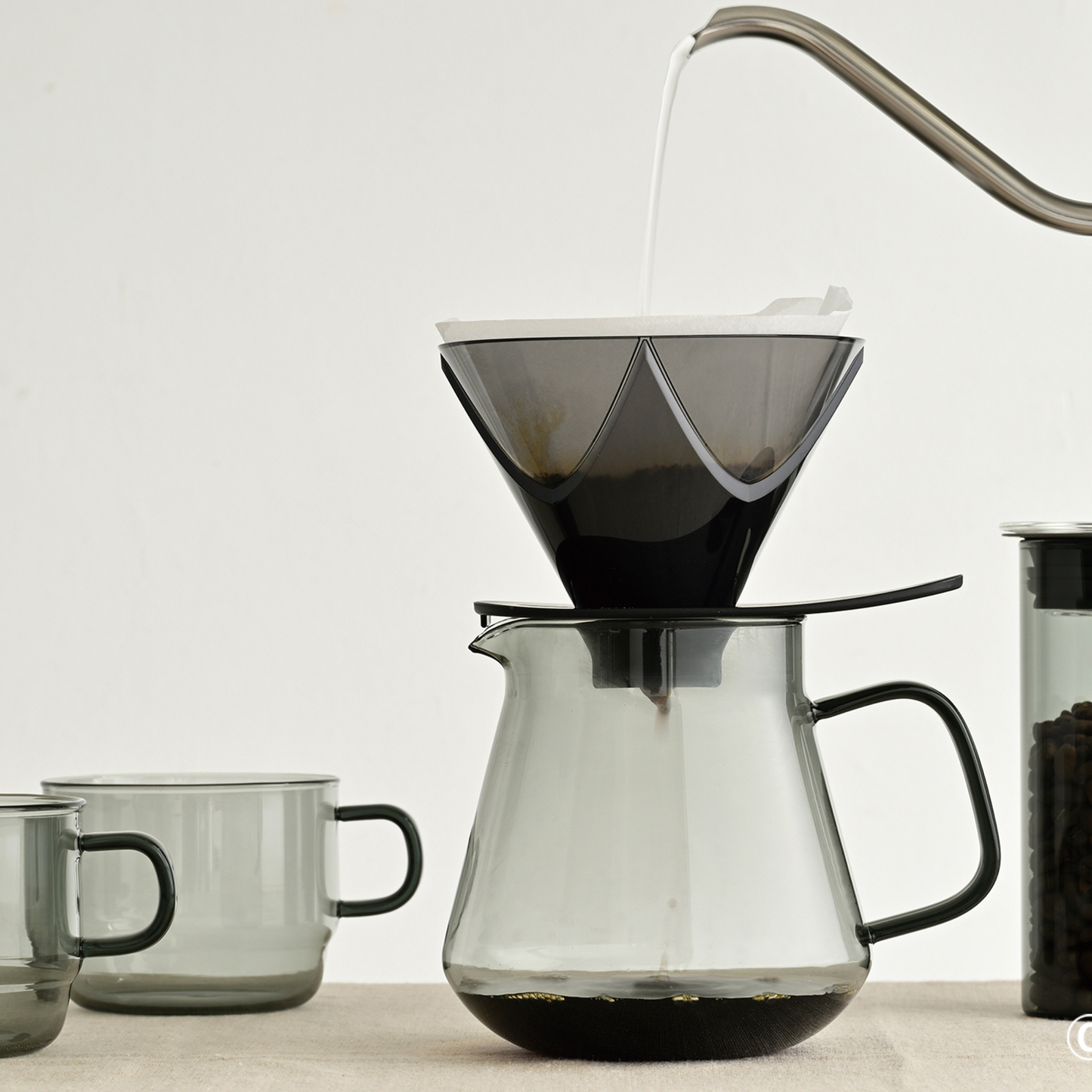 Dripping coffee to the Hario Glass Tea Server Grey, which is made from heatproof glass.