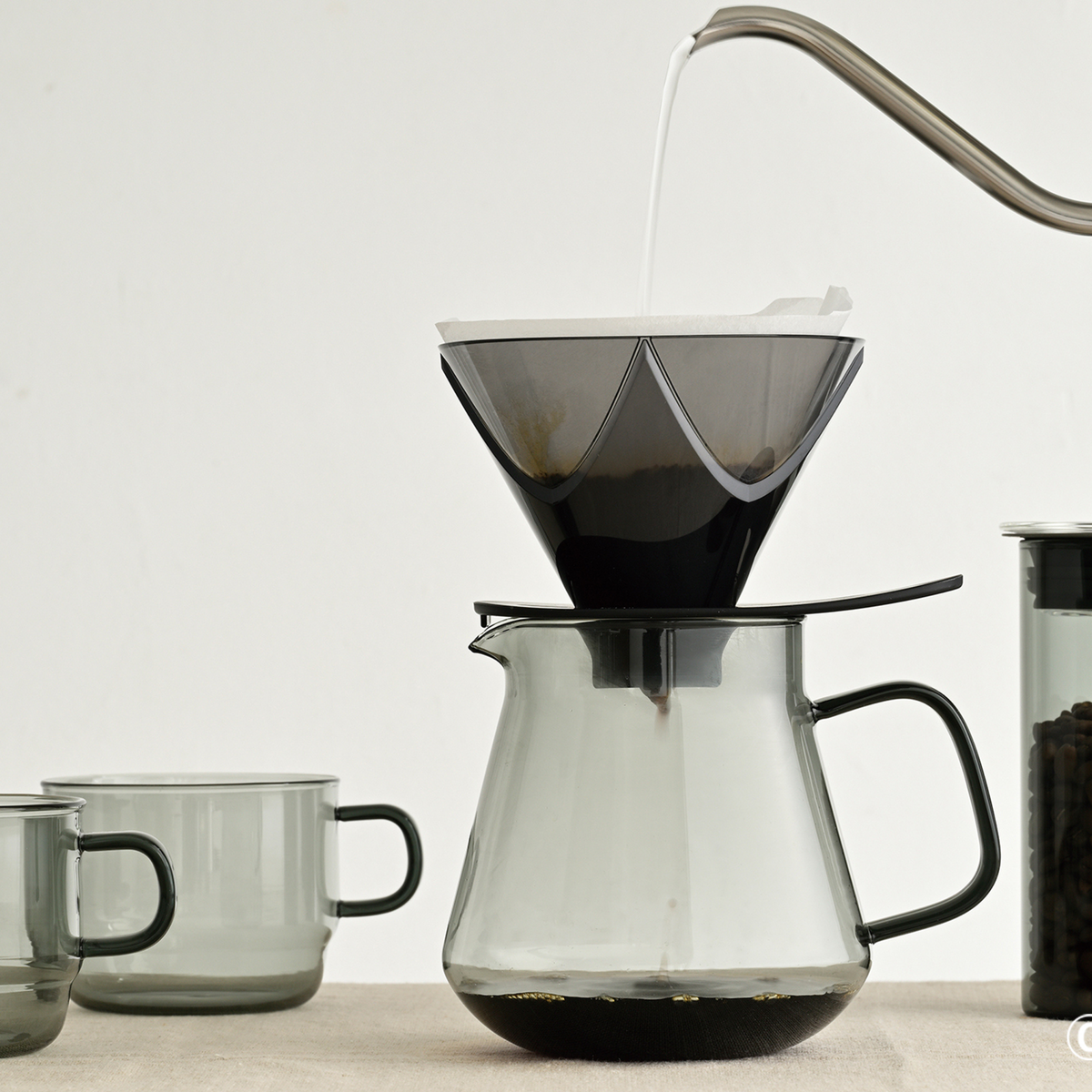 Dripping coffee to the Hario Glass Tea Server Grey, which is made from heatproof glass.