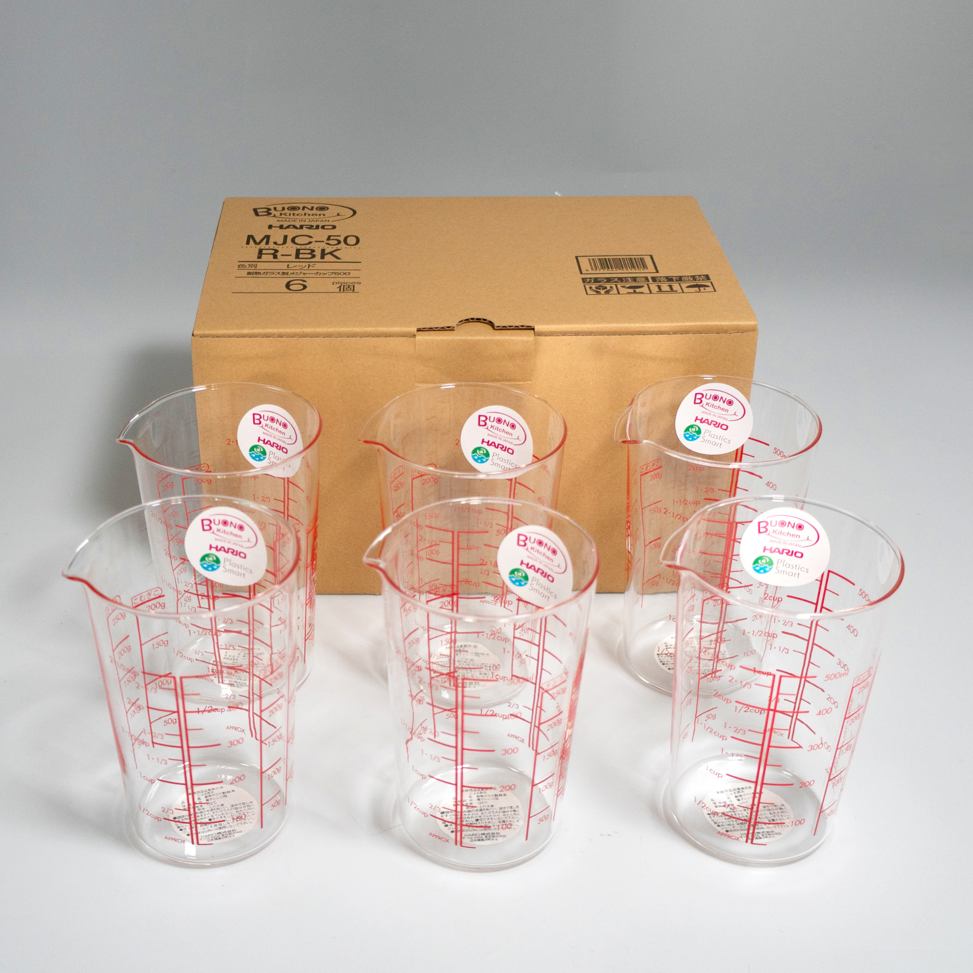 Group of HARIO Measuring Cup, 500mL capacity, red markings for clear visibility from above, made of heatproof glass, suitable for measuring liquids, sugar, and flour, microwave and hot water safe.