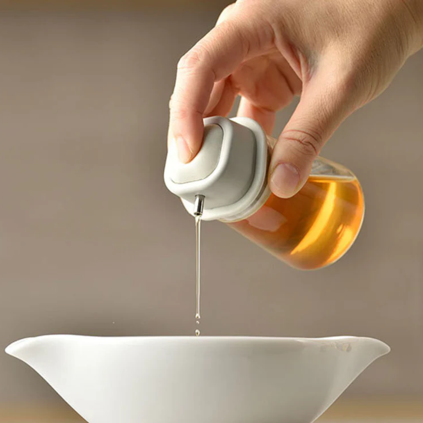 Shown pouring through the One Push Pale grey HARIO Soy Sauce Bottle, refillable 80mL heatproof glass dispenser with stainless steel spout and silicone-sealed lid for easy, spill-free pouring.