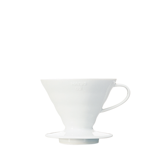 HARIO V60 ceramic coffee dripper white porcelain with spiral ridges and conical shape for adjustable brewing flow, includes polypropylene measuring spoon.