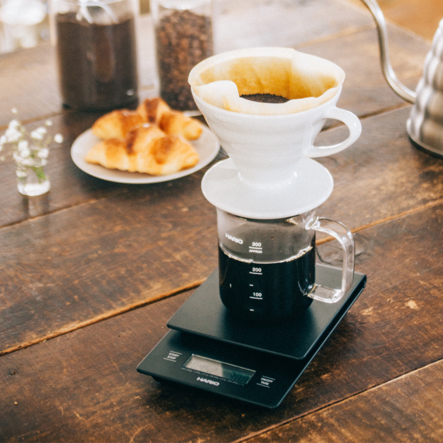 Coffee with the dripper being weighed to the HARIO V60 Drip Scale Black ABS resin with built-in timer and precision measurement up to 2000 grams.