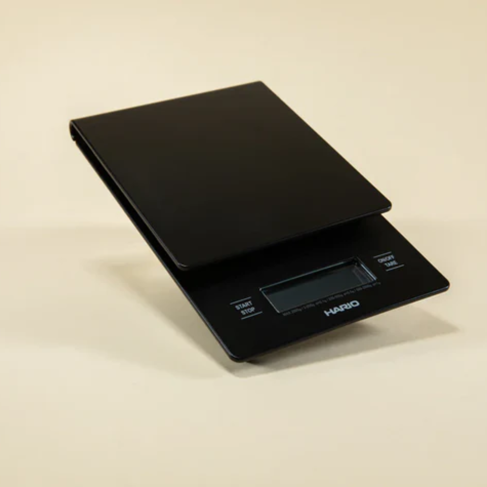 Elevated front view of HARIO V60 Drip Scale Black ABS resin with built-in timer and precision measurement up to 2000 grams.