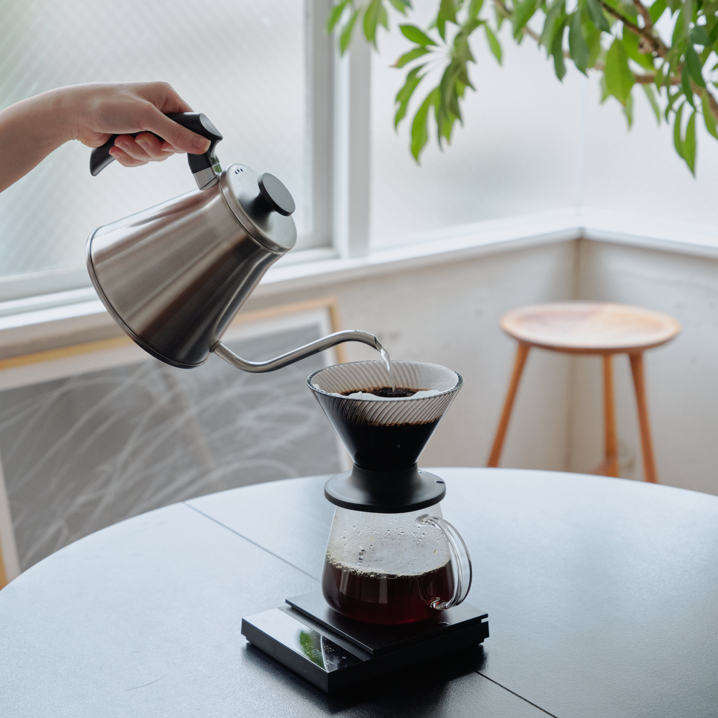 Dripping coffee from the Hario V60 Neo Coffee Dripper 02 Black which is made from PCT resin and silicone rubber, with detachable base for hybrid brewing.