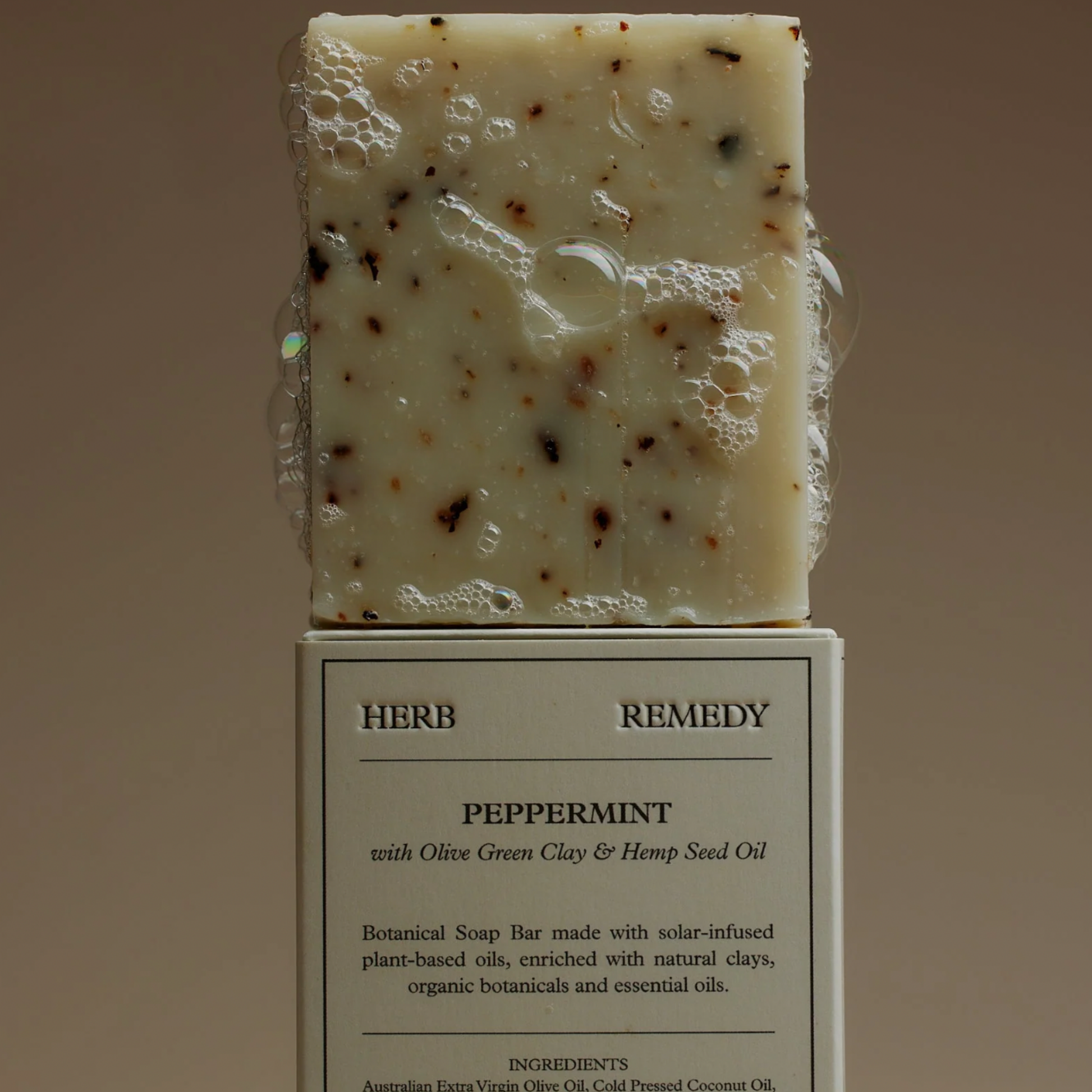 Herb Remedy botanical peppermint soap front view on top of the cardboard box