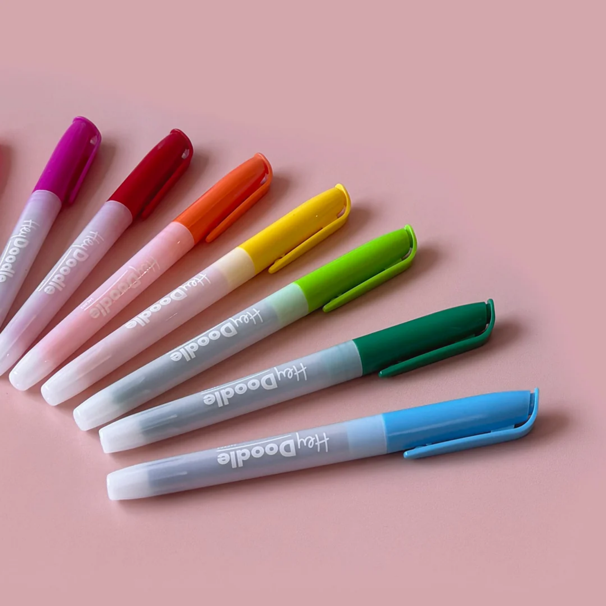 Showing the 12 color markers from Hey Doodle Standard Colour Markers - 12 non-toxic erasable markers, safe for kids, smudge-free when dry, includes 3 bonus colors, perfect for left-handed use, child-safe art set for creative play and learning.